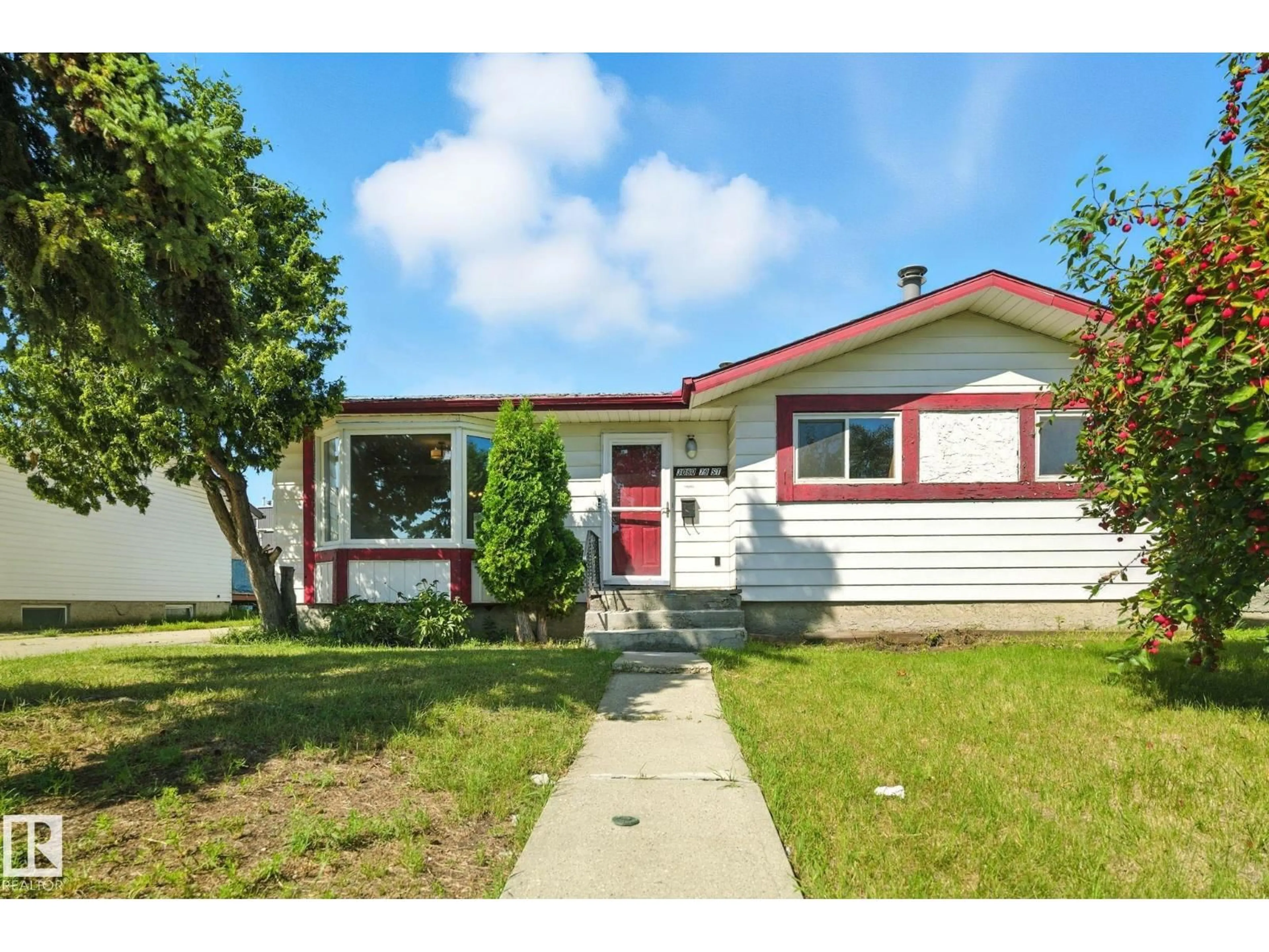 Home with vinyl exterior material, street for 3080 79 ST NW, Edmonton Alberta T6K3W1