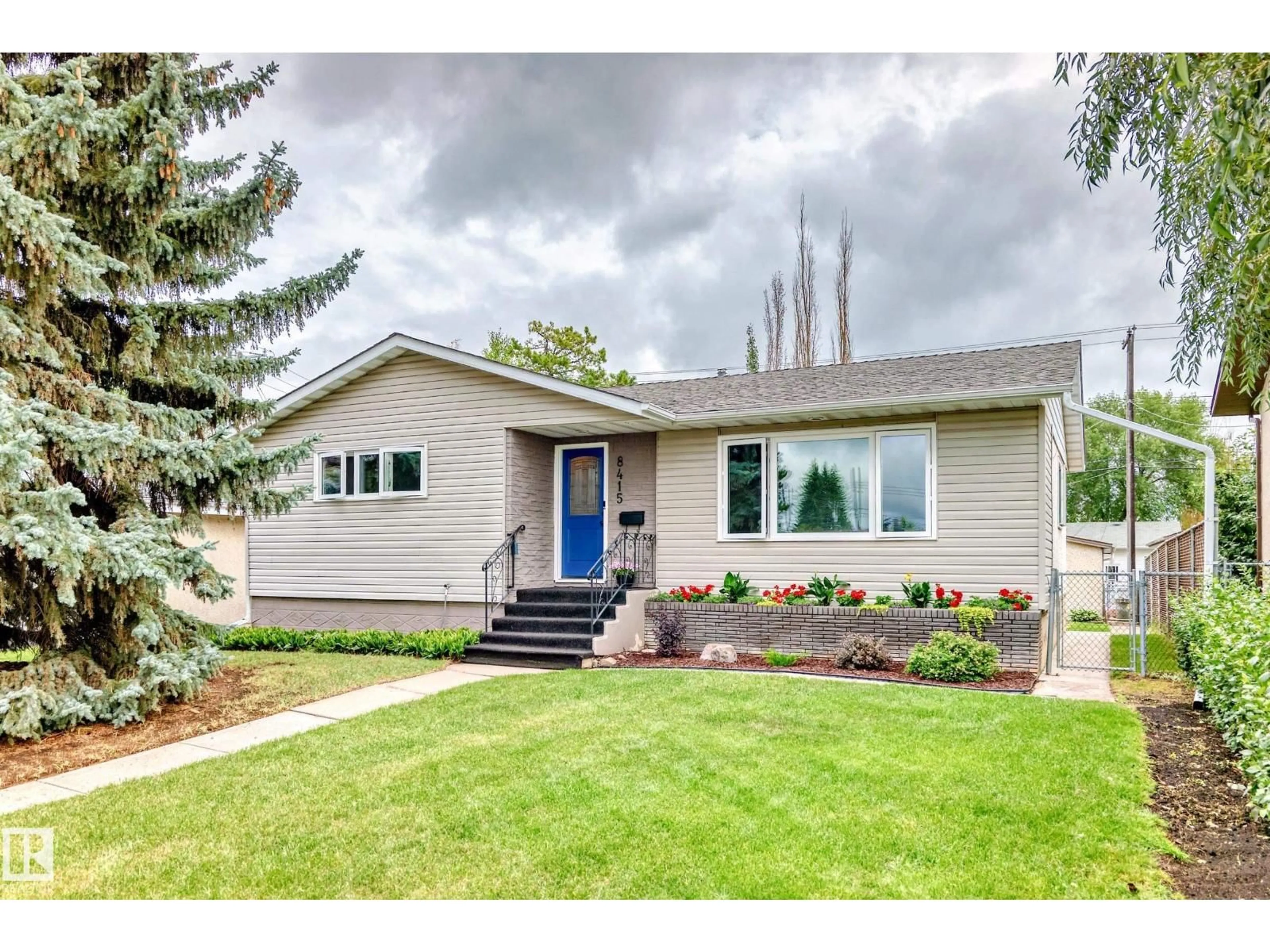 Home with vinyl exterior material, street for NW - 8415 72 ST, Edmonton Alberta T6B1Y3