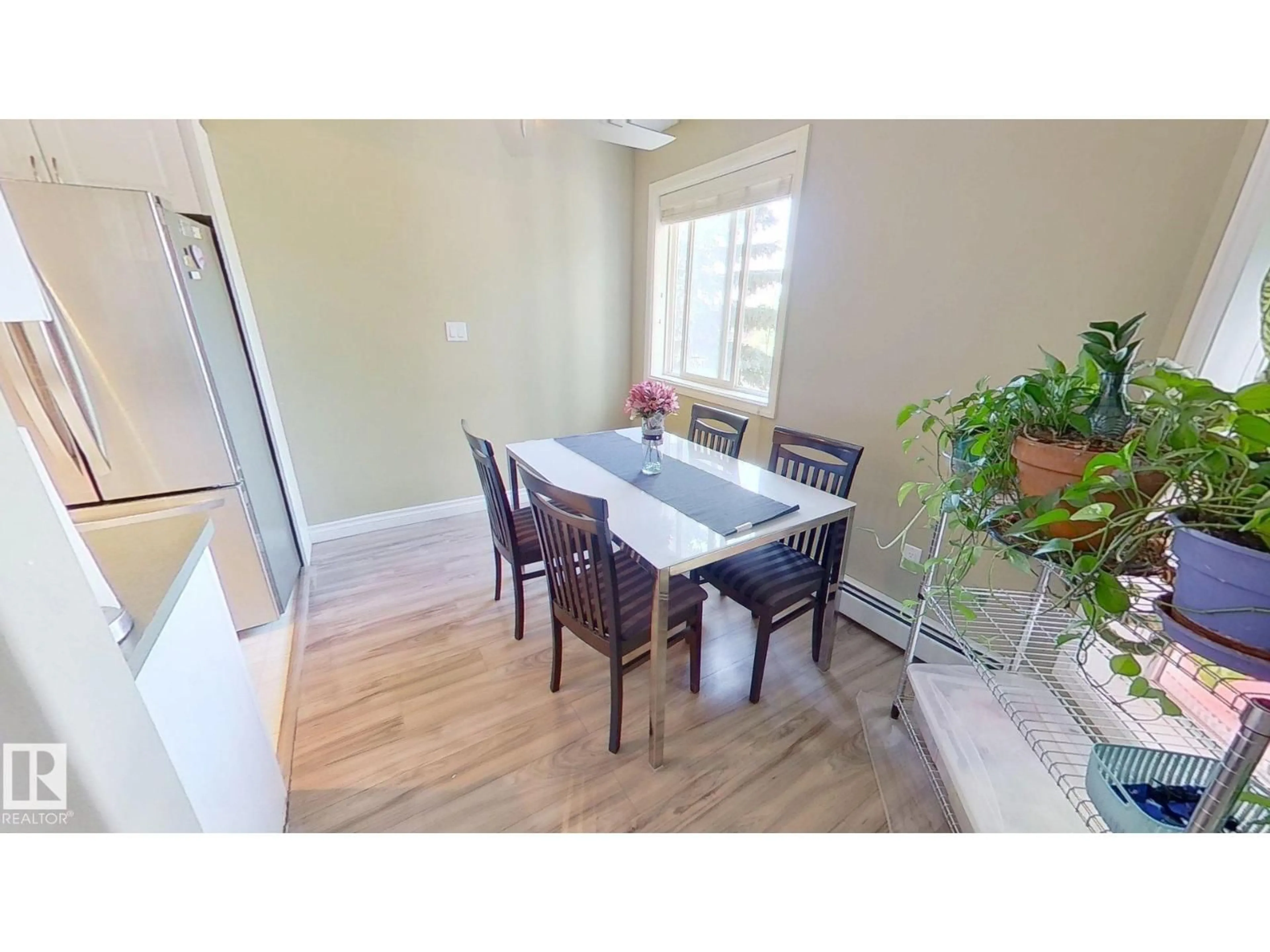Dining room, wood/laminate floor for #208 - 11446 40 AV, Edmonton Alberta T6J0R5
