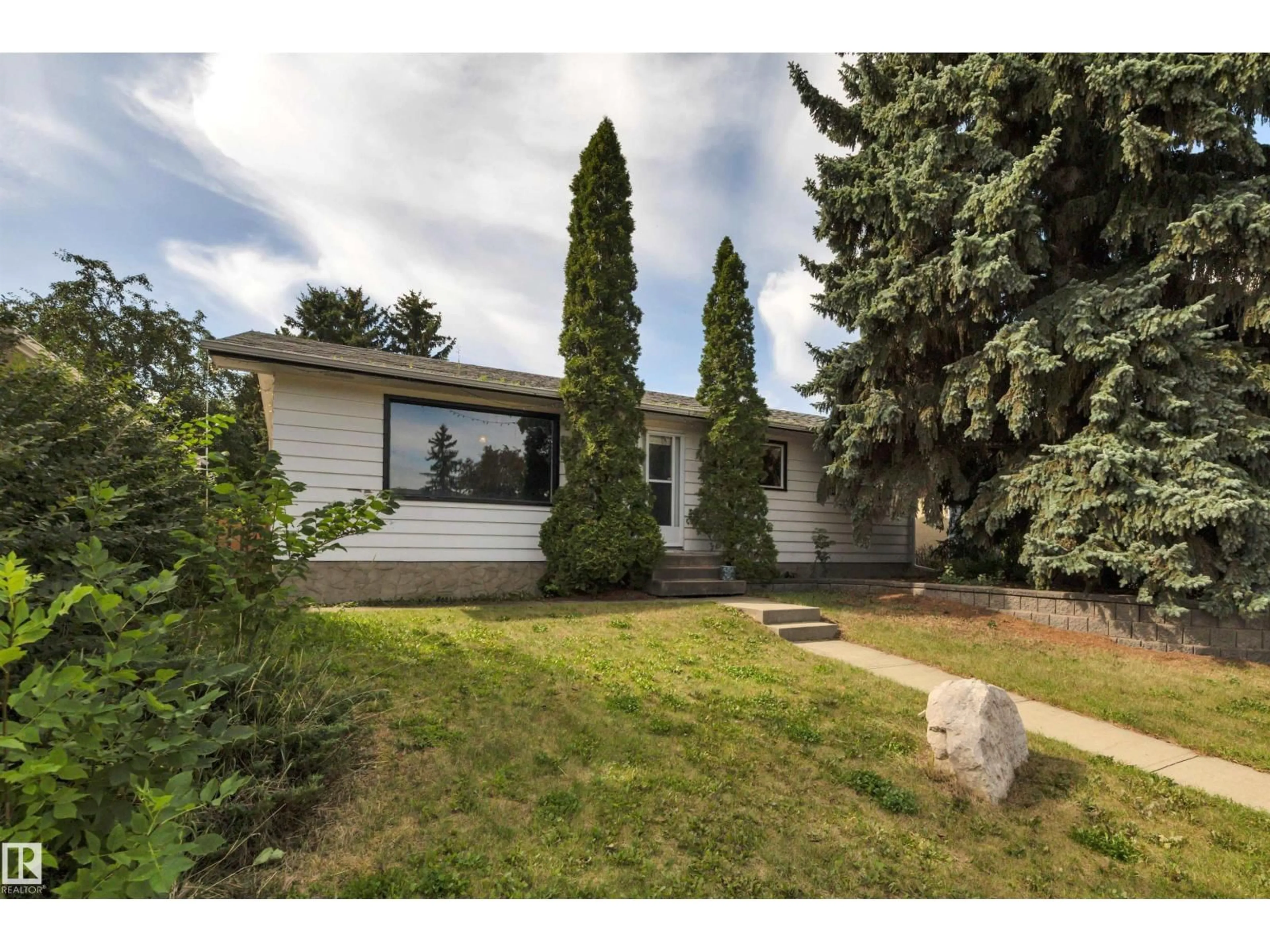 Home with vinyl exterior material, street for 3111 106 AV, Edmonton Alberta T5W0C1