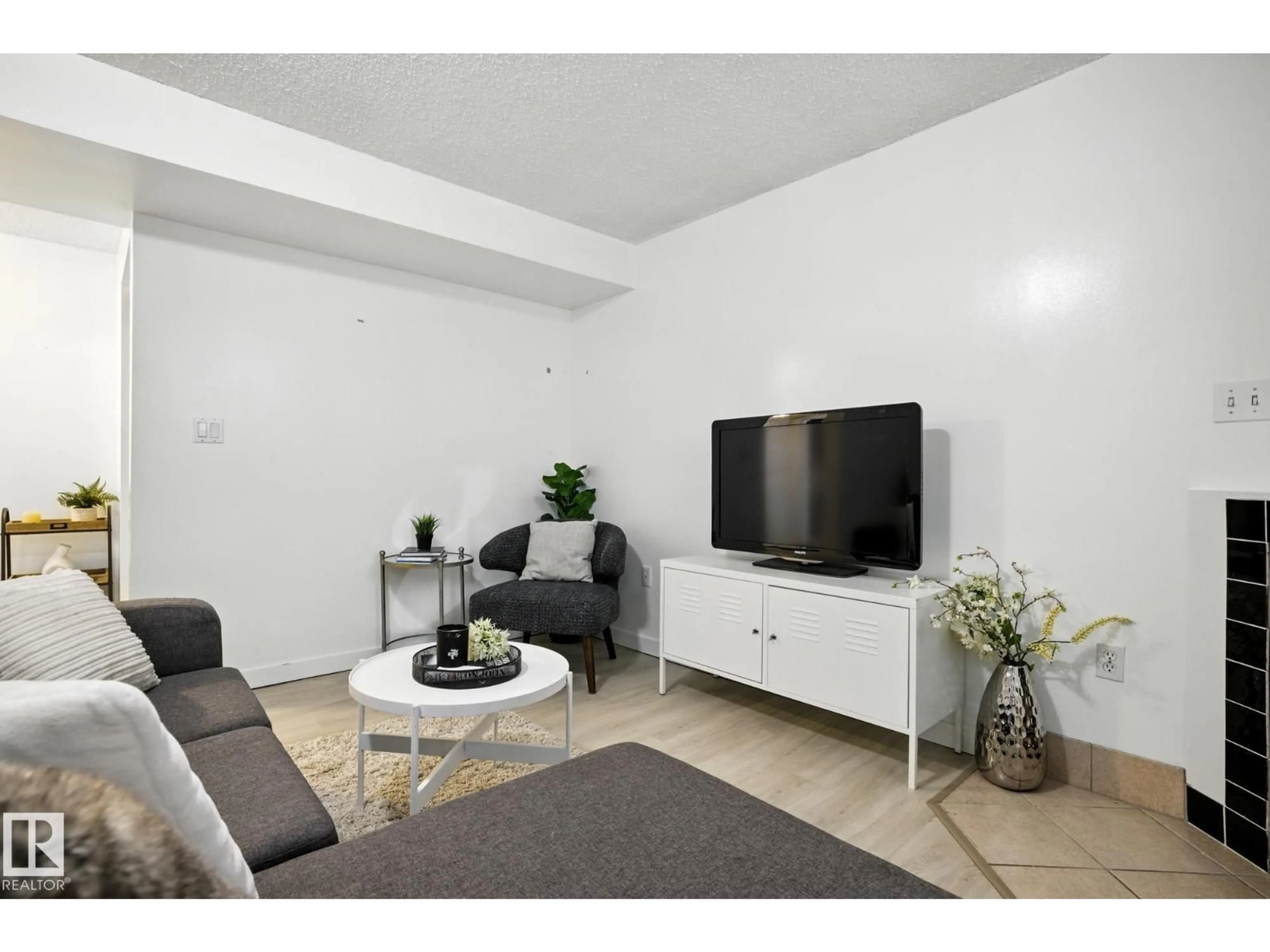 Living room with furniture, unknown for NW - 11112/11116 116 ST, Edmonton Alberta T5G2V6