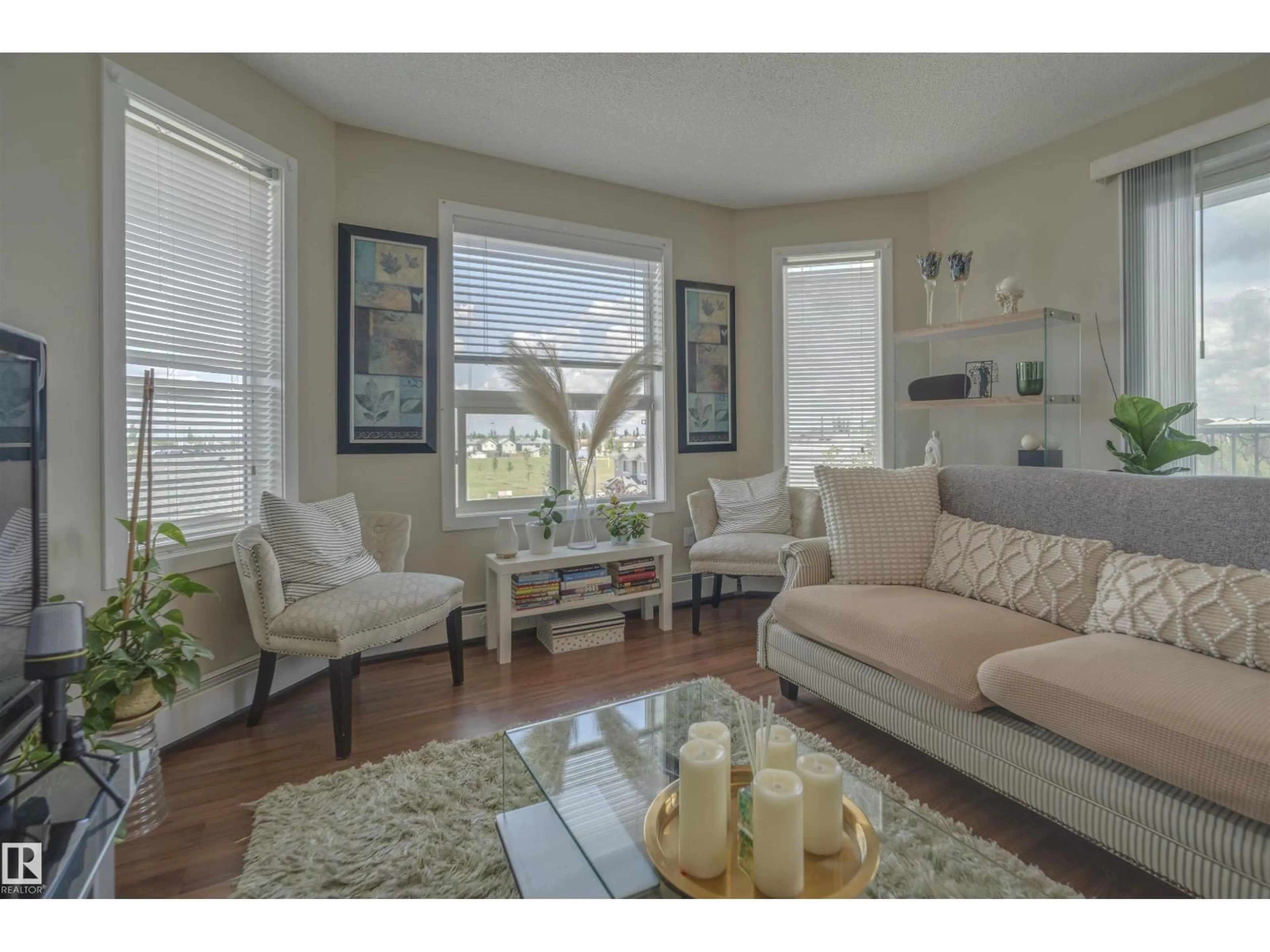 Living room with furniture, wood/laminate floor for #303 - 392 SILVER BERRY RD, Edmonton Alberta T6T0H1