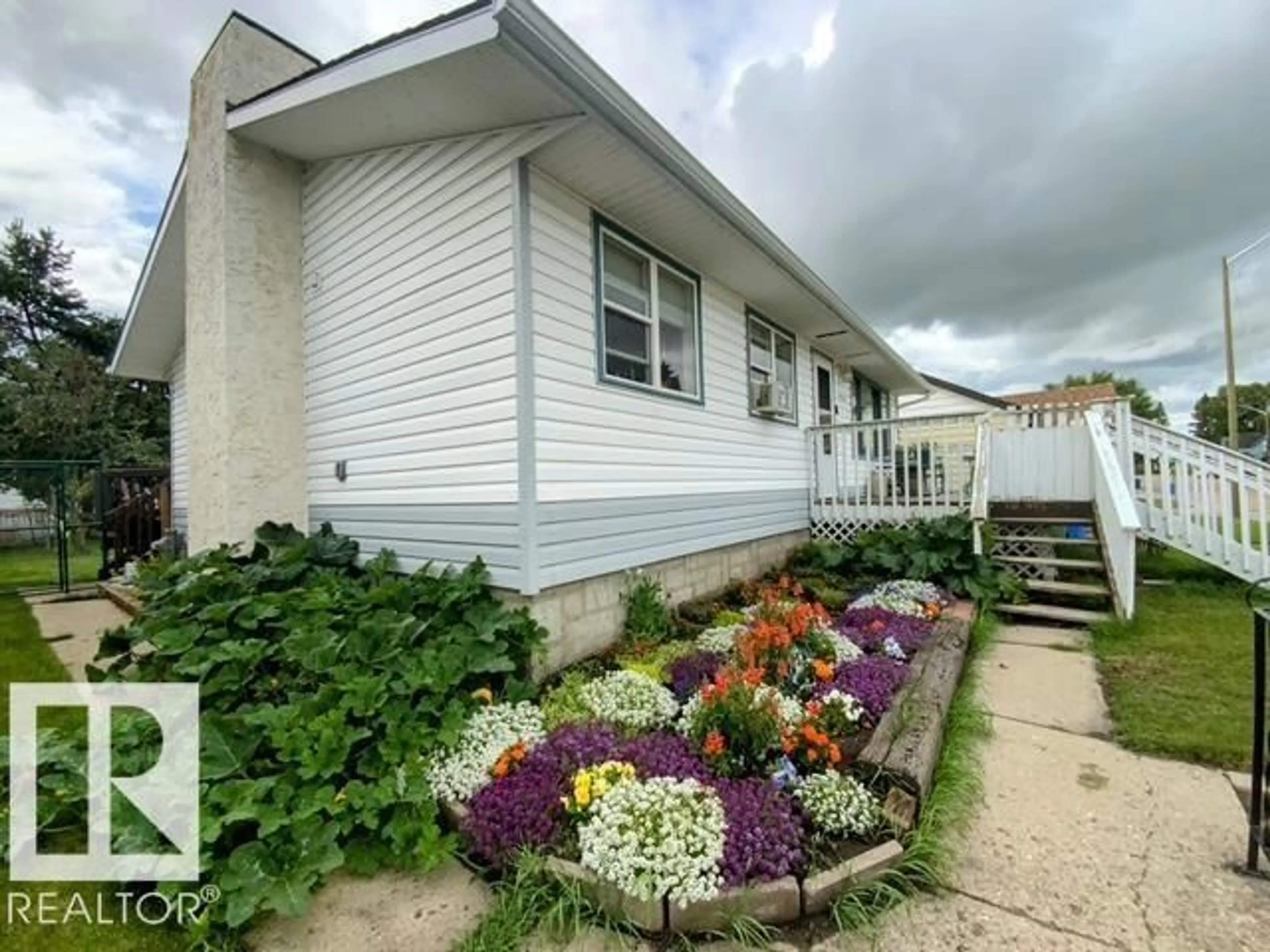 Home with vinyl exterior material, street for 4122 53 ST, Wetaskiwin Alberta T9A1P8