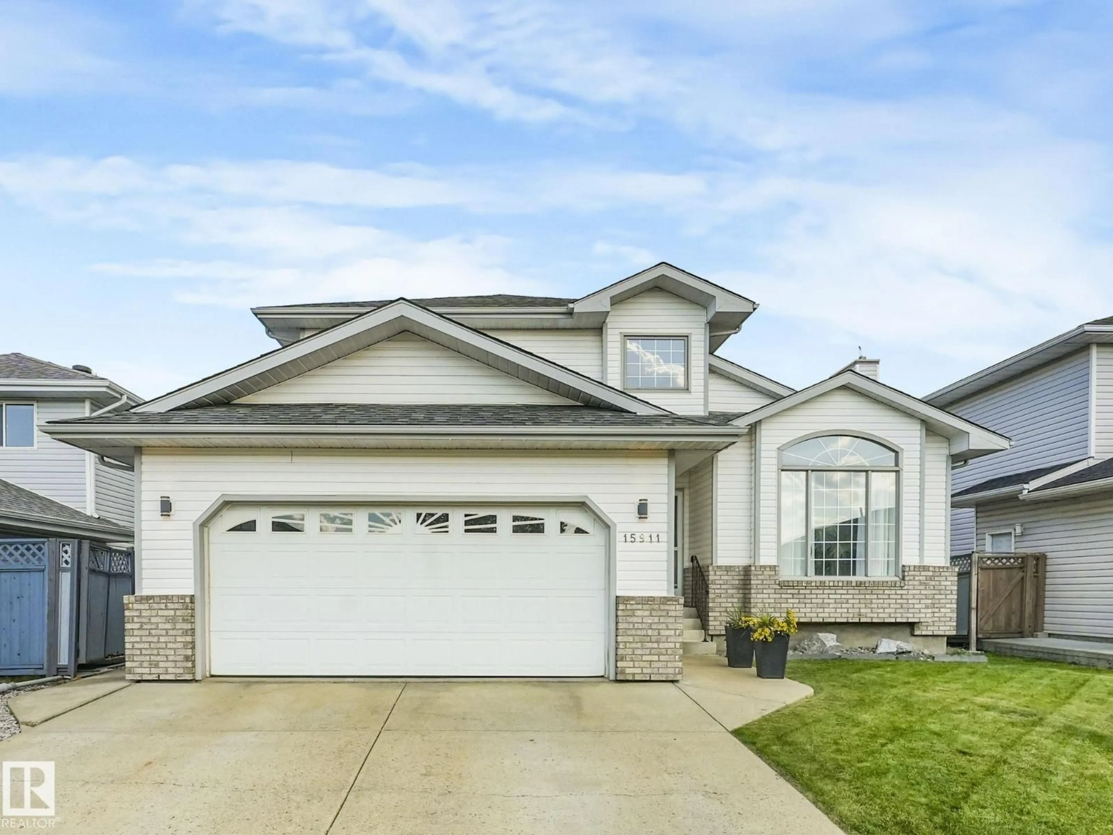 Home with vinyl exterior material, street for 15911 59 ST, Edmonton Alberta T5Y2R4