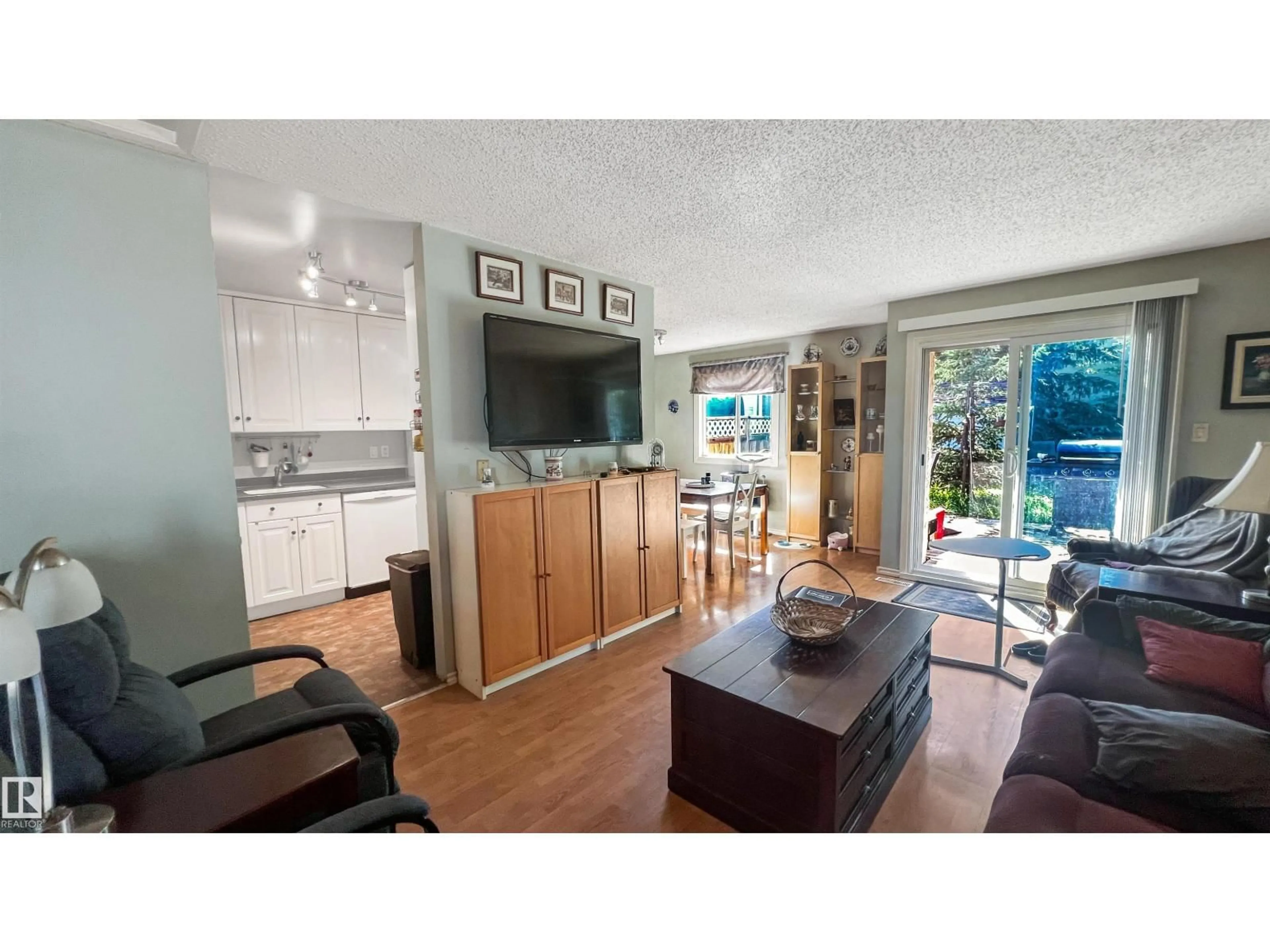 Open concept kitchen, wood/laminate floor for 3 GOLD EYE DR, Devon Alberta T9G1W1