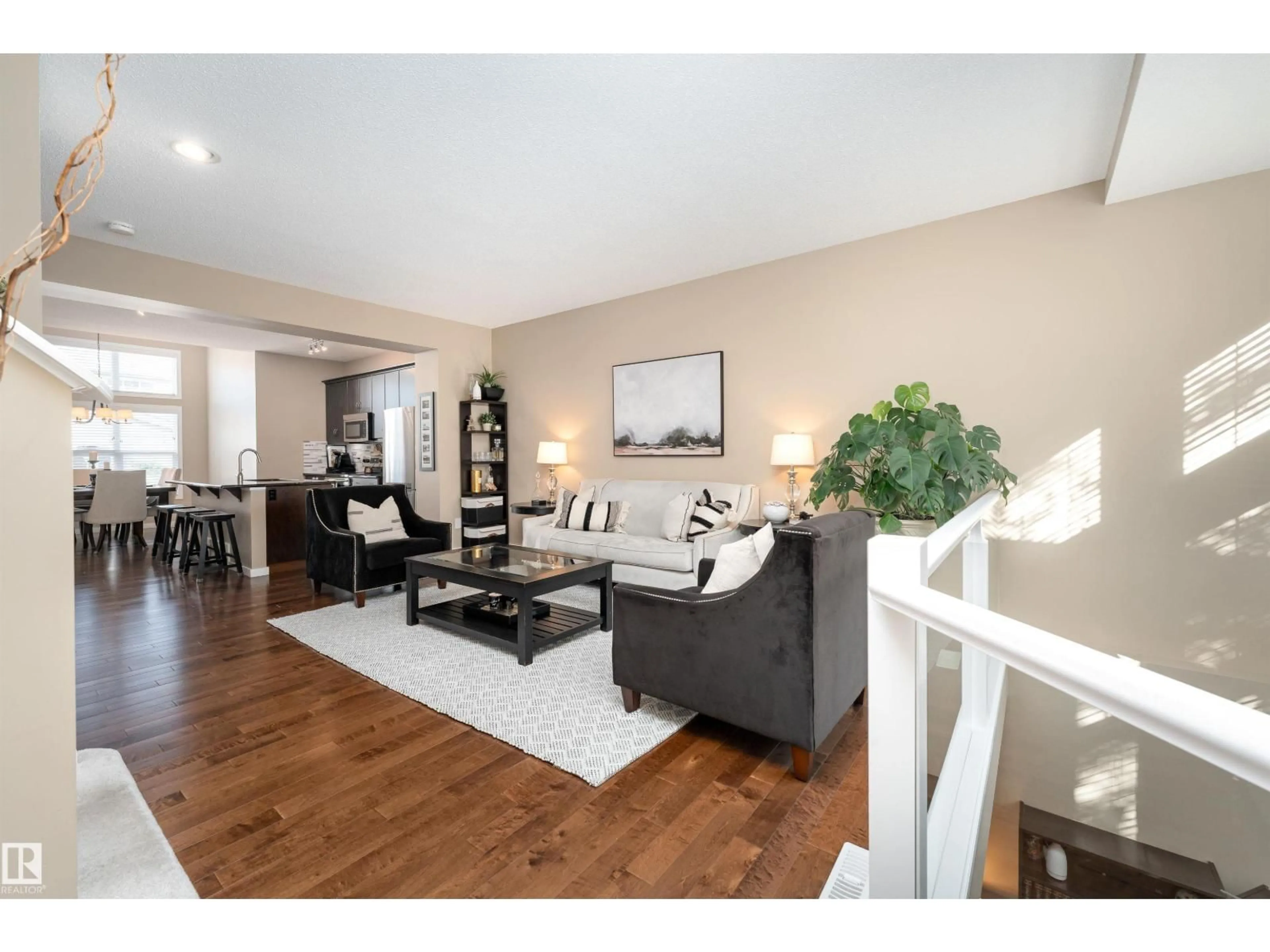 Living room with furniture, wood/laminate floor for 633 MCDONOUGH LI NW, Edmonton Alberta T5Y0K8