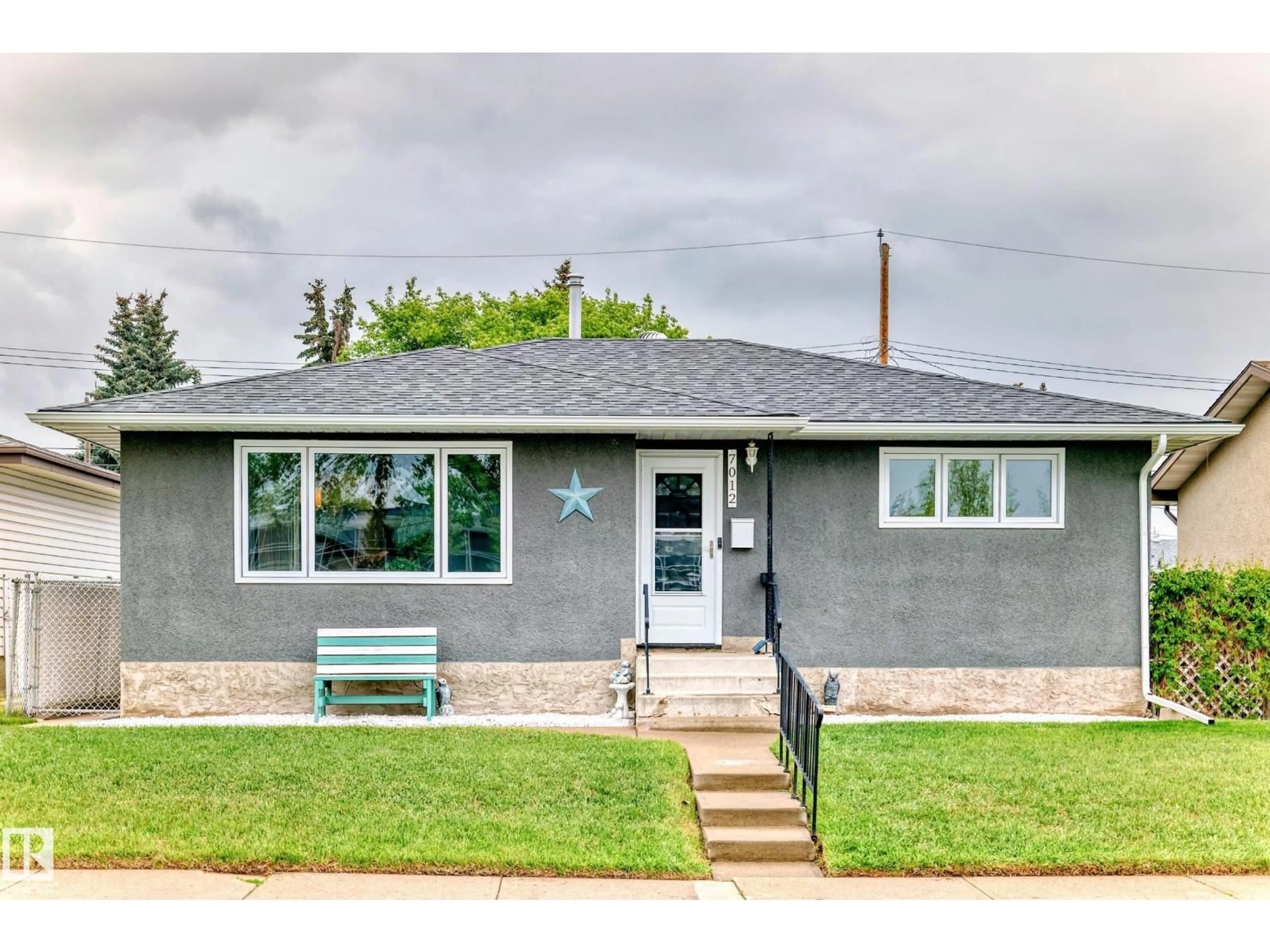 Home with vinyl exterior material, street for 7012 132 AV, Edmonton Alberta T5C2A6