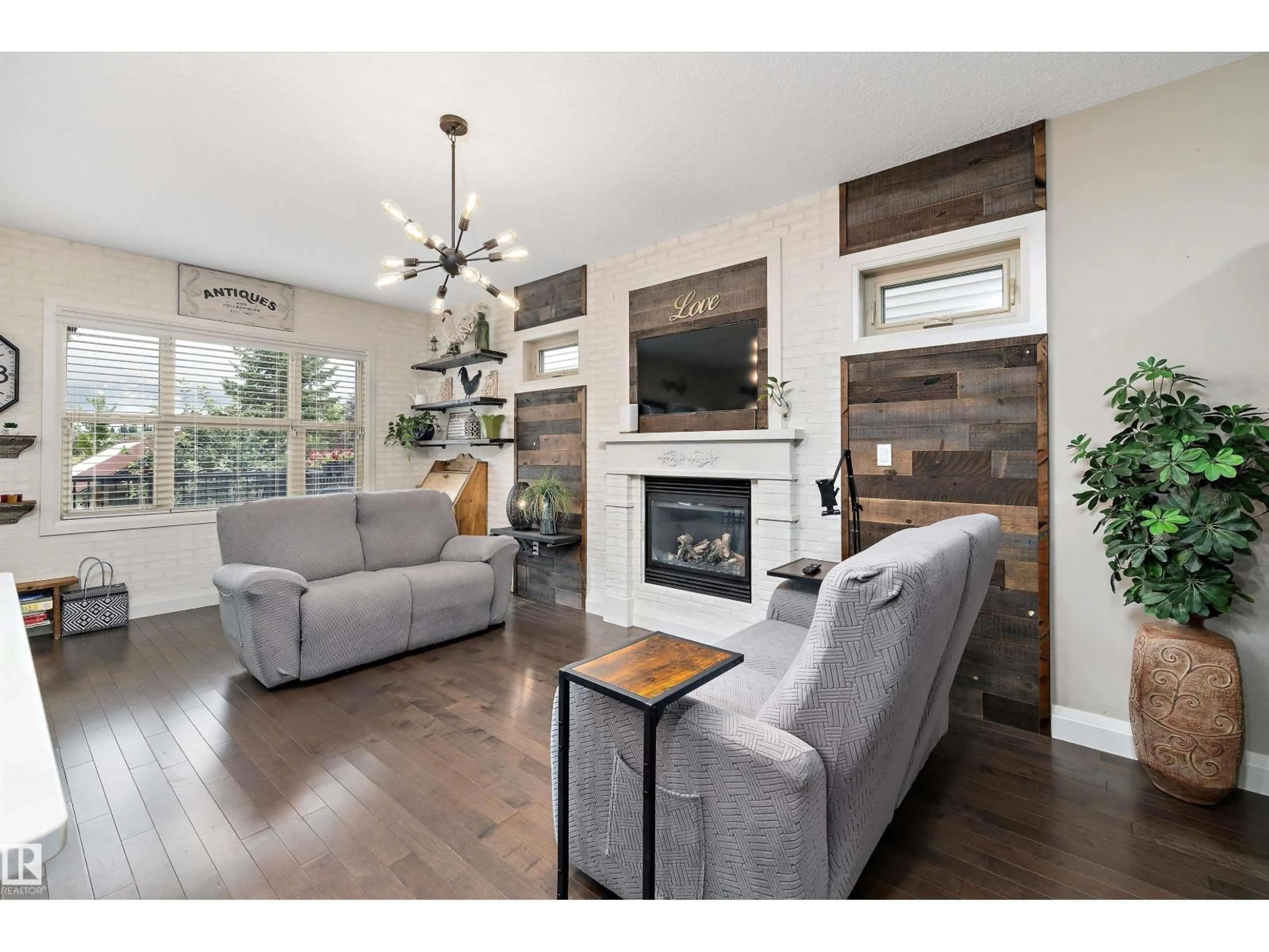 Living room with furniture, wood/laminate floor for 51 GREENBURY CR, Spruce Grove Alberta T7X0L9
