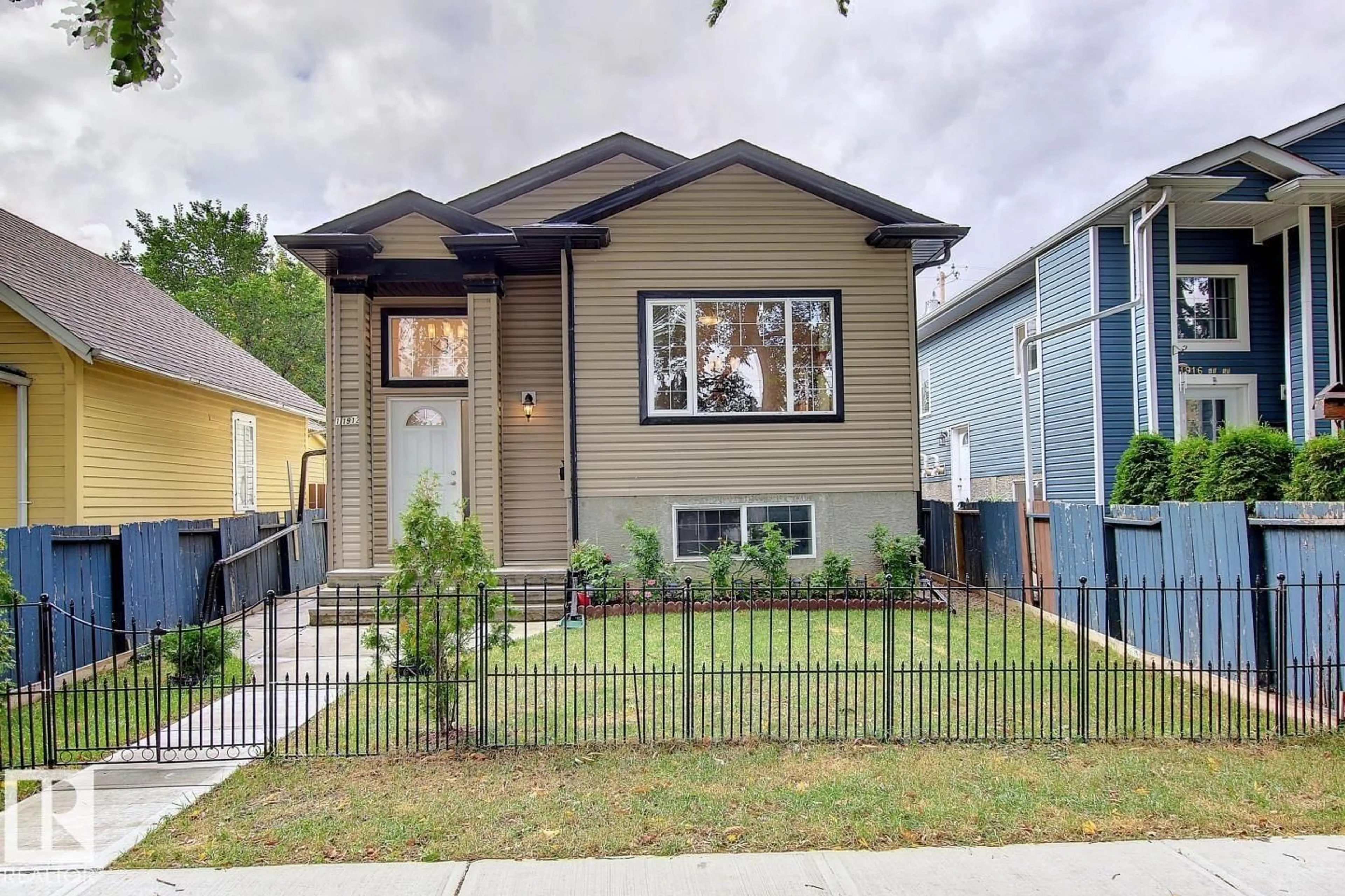 Home with vinyl exterior material, street for 11912 91 ST, Edmonton Alberta T5B4B6
