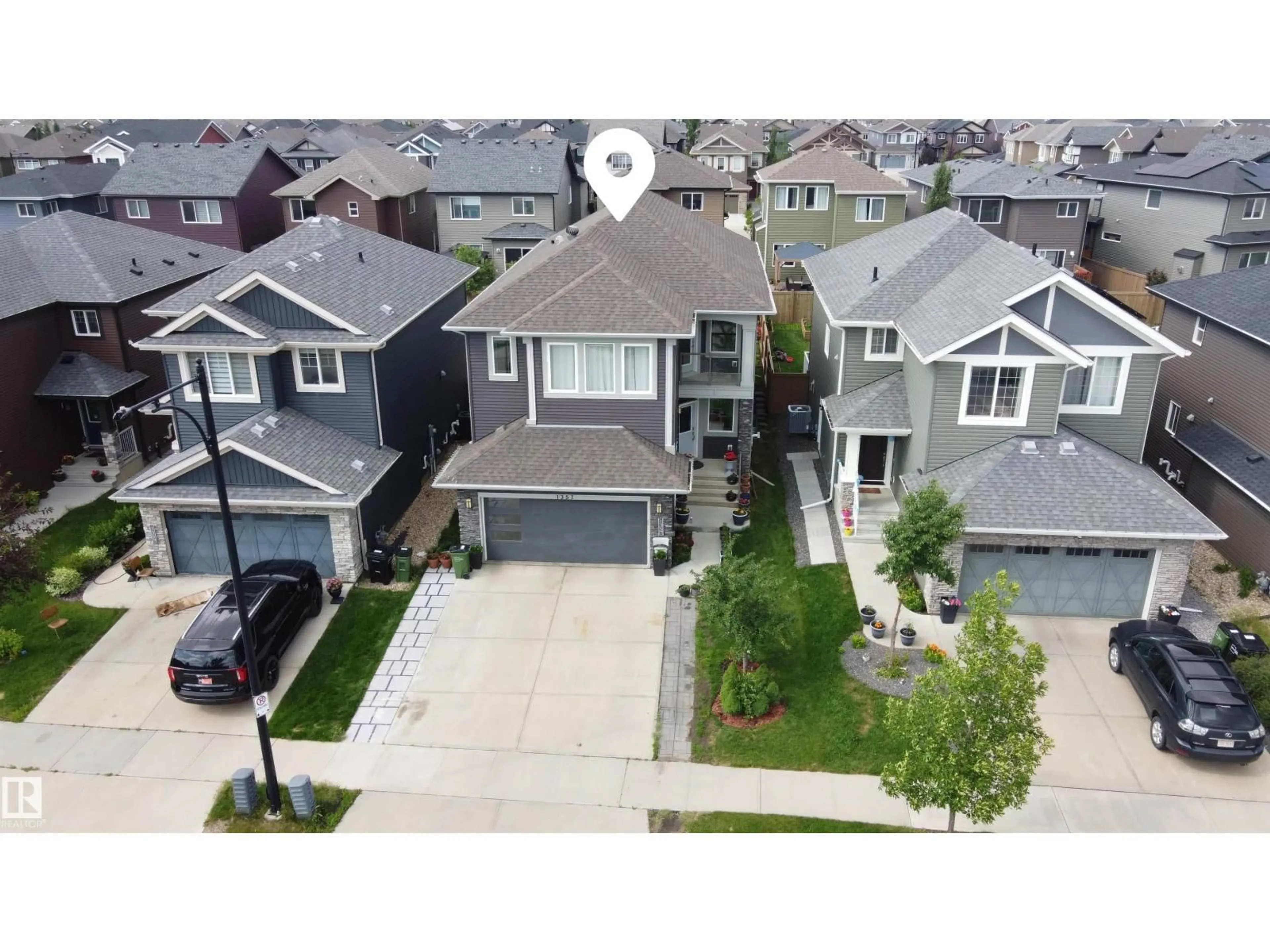 A pic from outside/outdoor area/front of a property/back of a property/a pic from drone, street for 1357 WATT DR, Edmonton Alberta T6X2A6