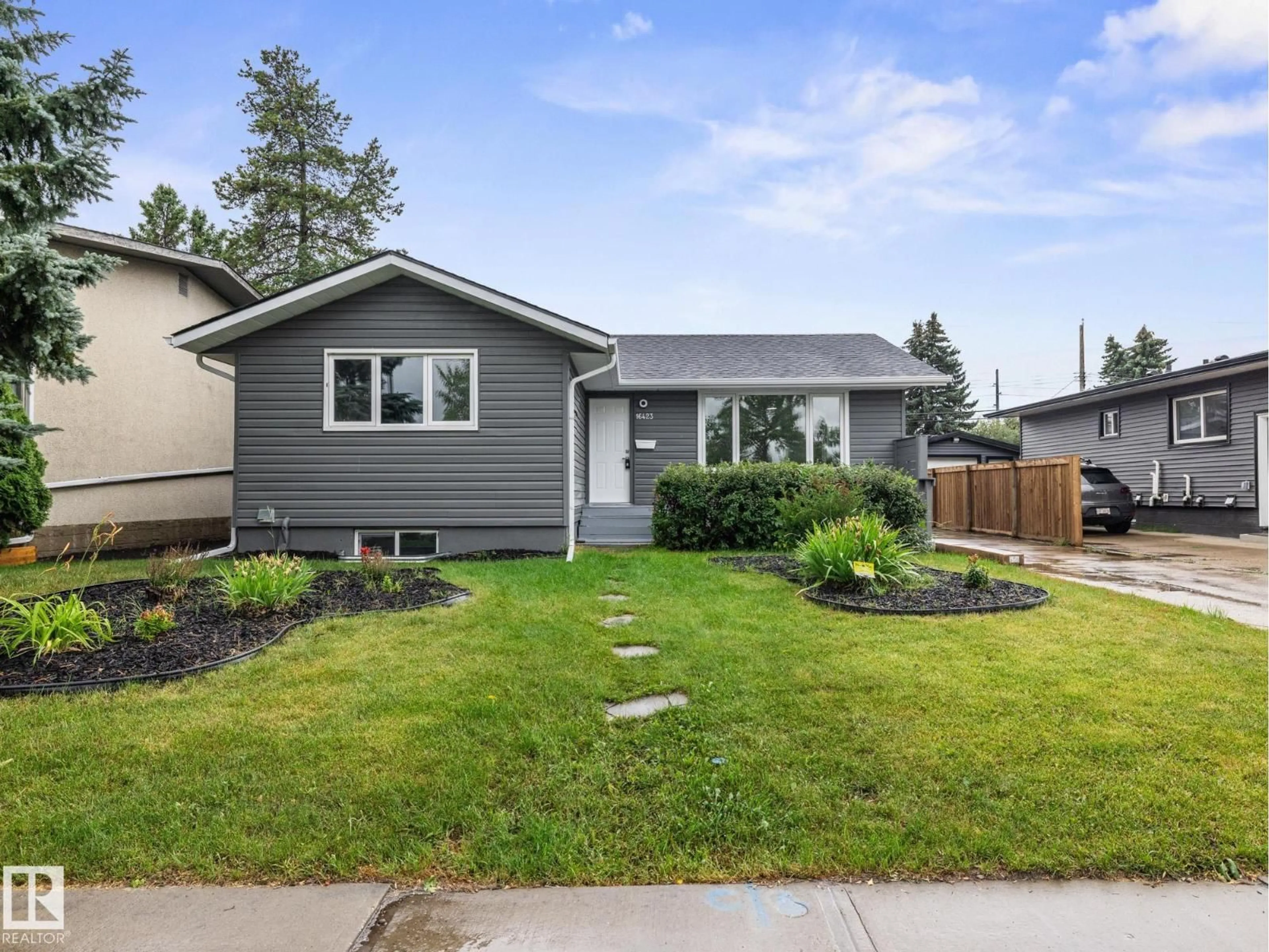 Home with vinyl exterior material, street for 16423 80 AV, Edmonton Alberta T5R3M8