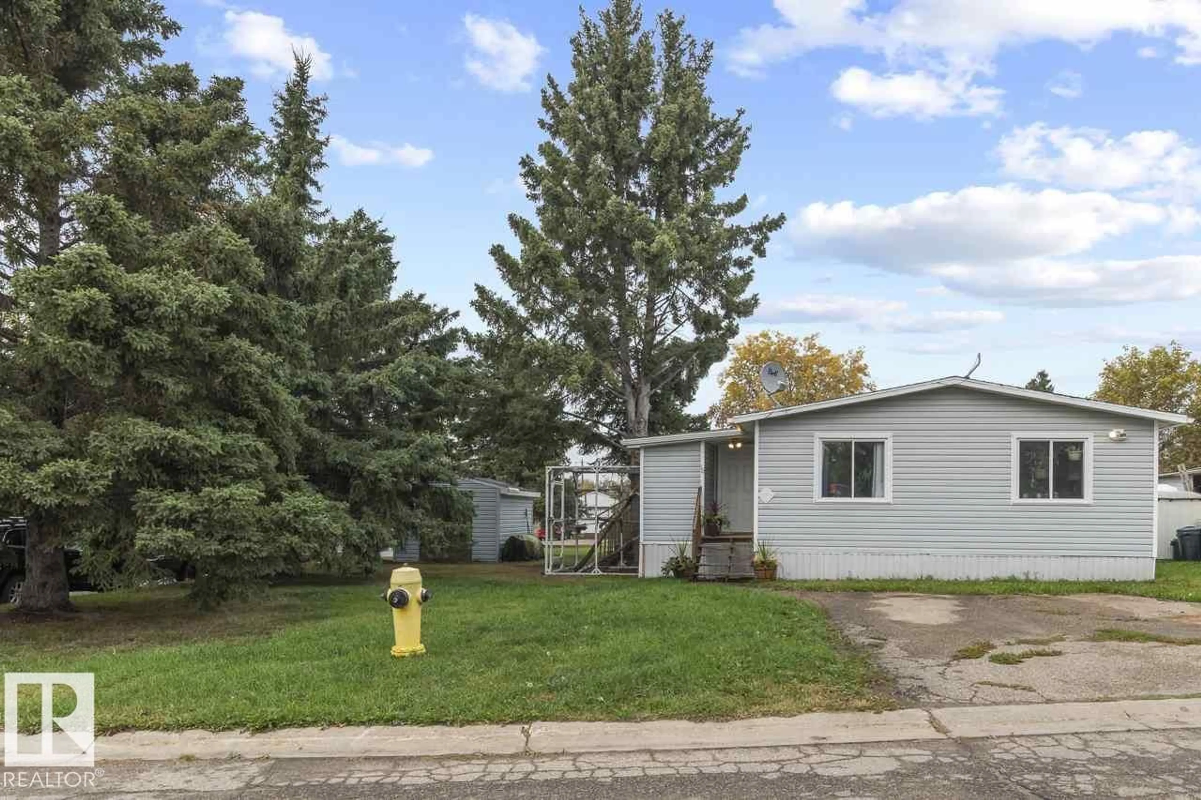Home with vinyl exterior material, street for 11 - 5612 53 AV, Cold Lake Alberta T9M1R7