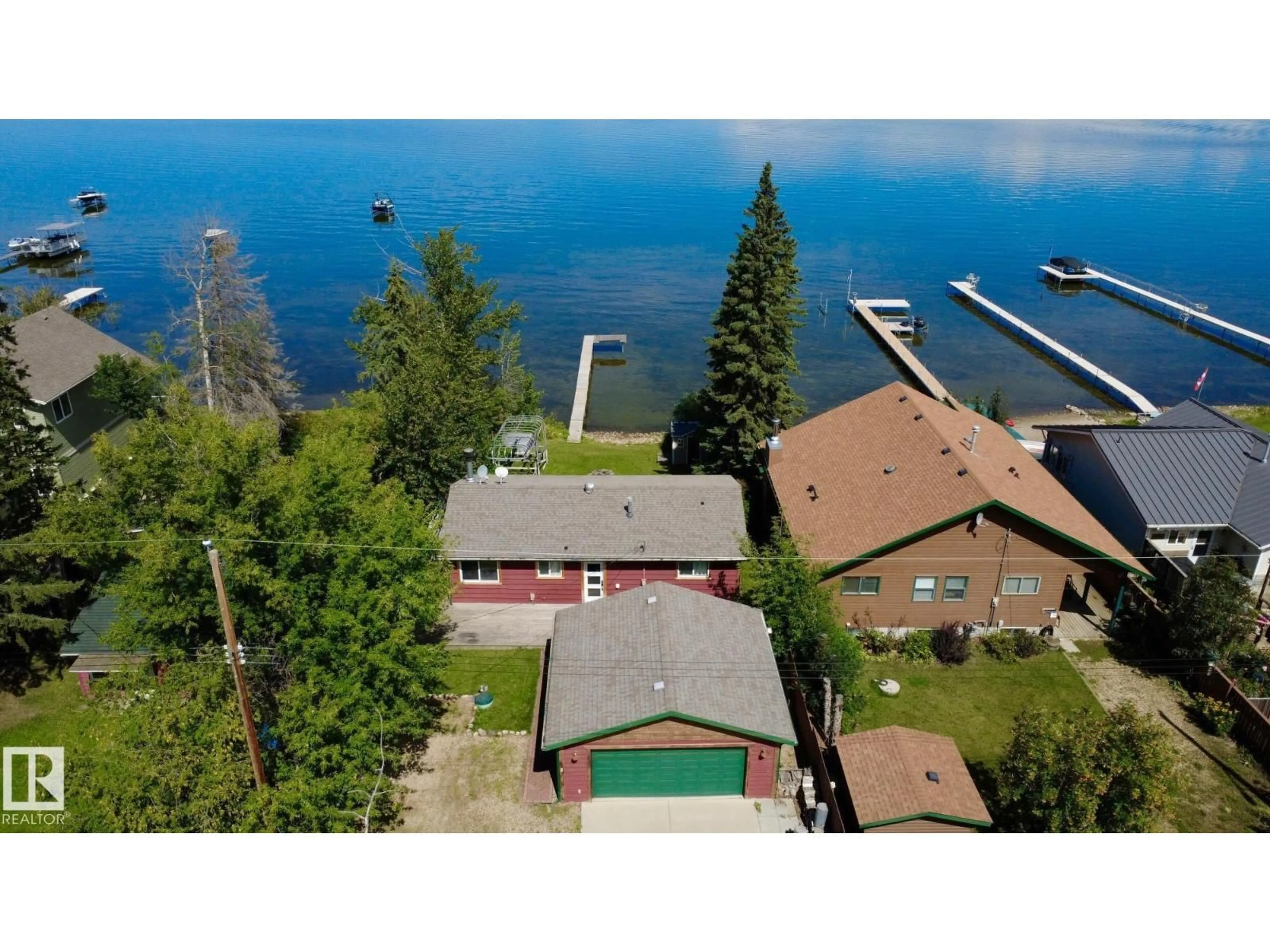 A pic from outside/outdoor area/front of a property/back of a property/a pic from drone, water/lake/river/ocean view for 8 LAKE AV, Rural Wetaskiwin County Alberta T0C2V0