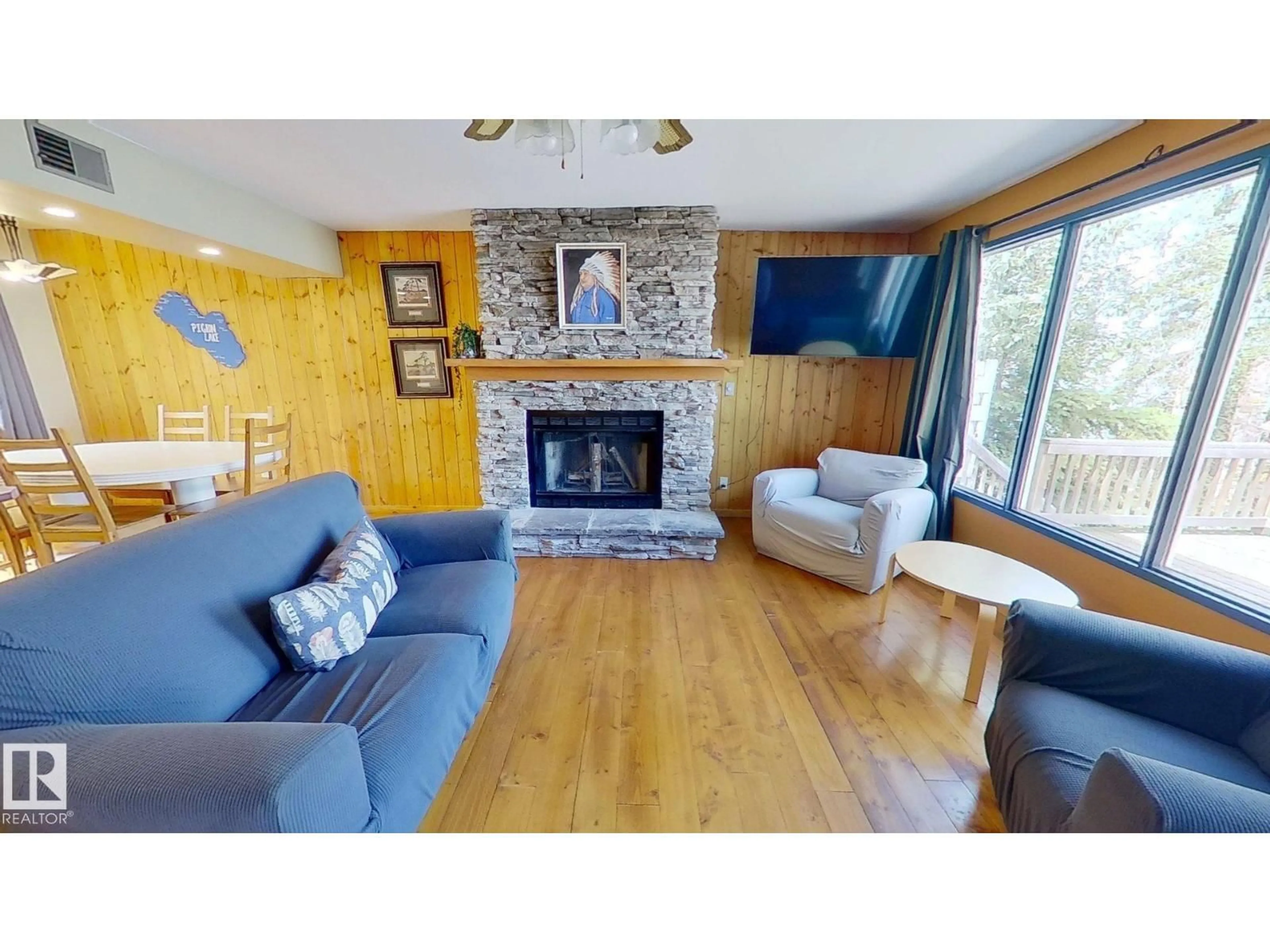 Living room with furniture, wood/laminate floor for 8 LAKE AV, Rural Wetaskiwin County Alberta T0C2V0