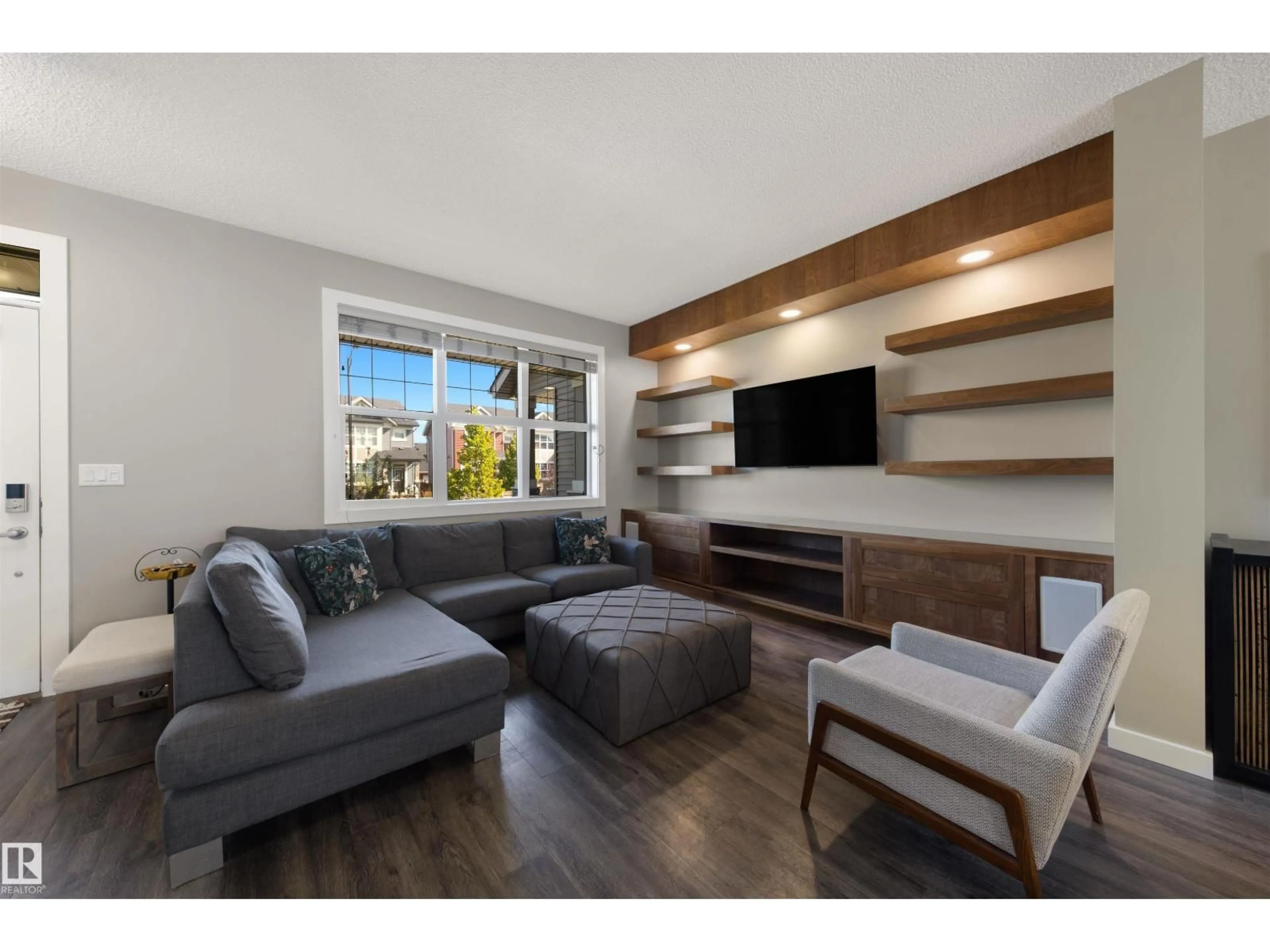 Living room with furniture, wood/laminate floor for 2233 GLENRIDDING BV, Edmonton Alberta T6W3E5