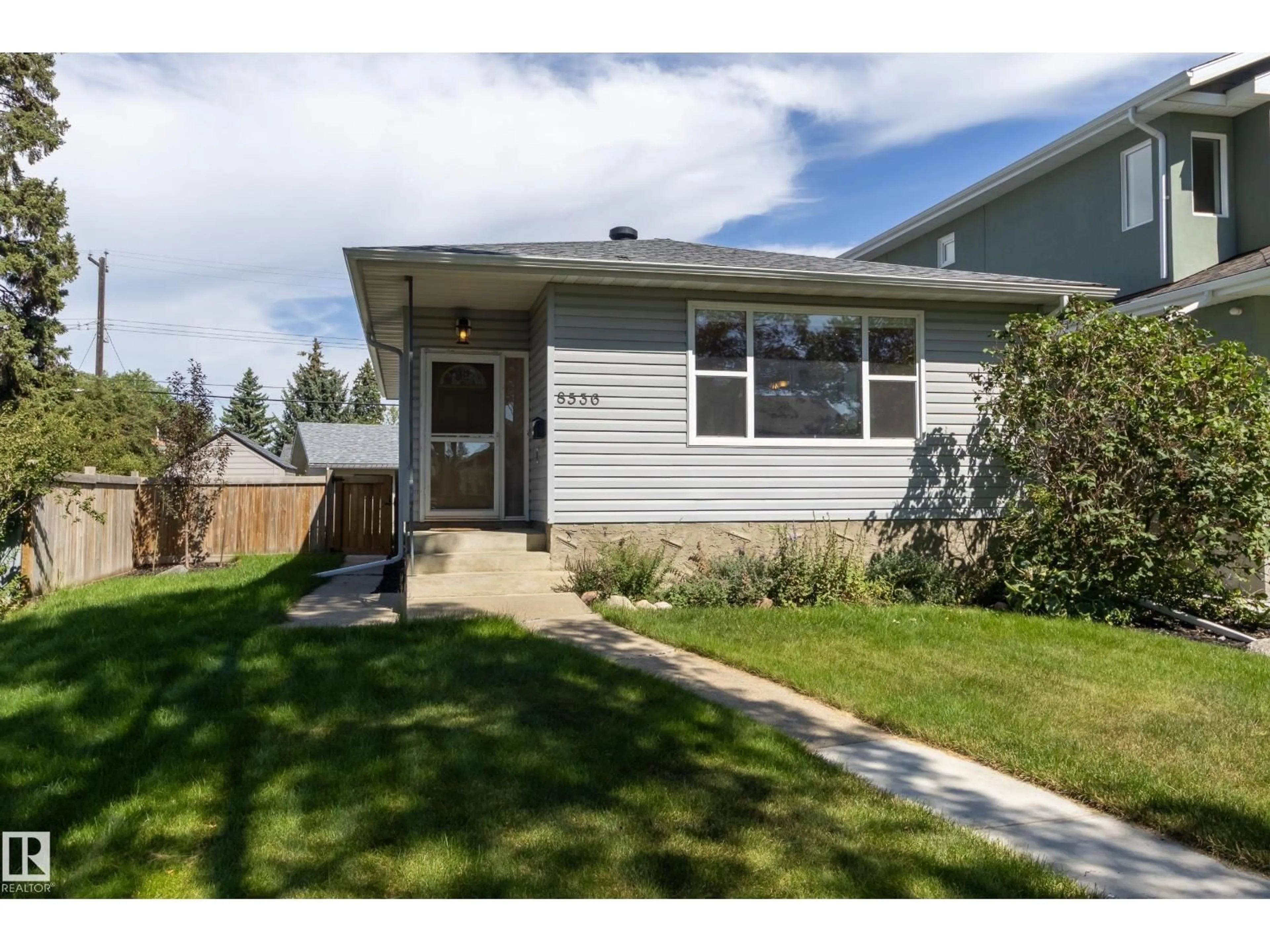 Home with vinyl exterior material, street for 8536 75 AV, Edmonton Alberta T6C0H1
