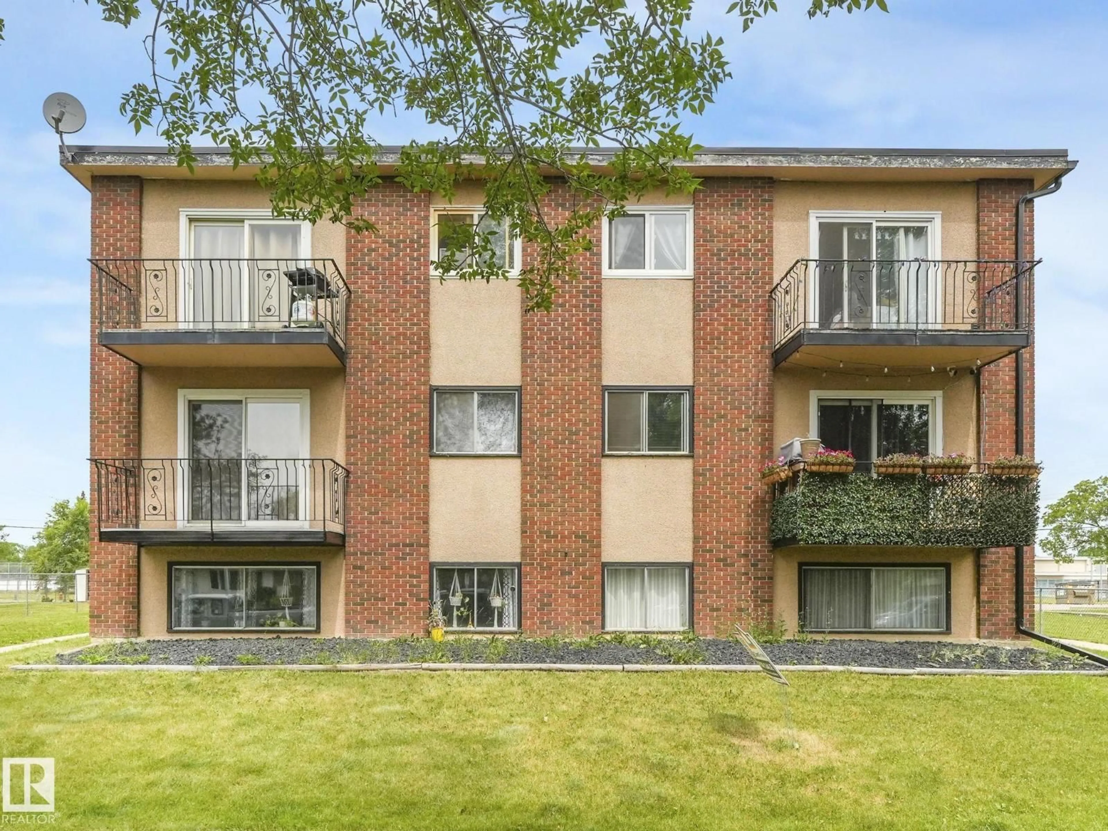 A pic from outside/outdoor area/front of a property/back of a property/a pic from drone, building for #103 - 15930 109 AV, Edmonton Alberta T5P1B7