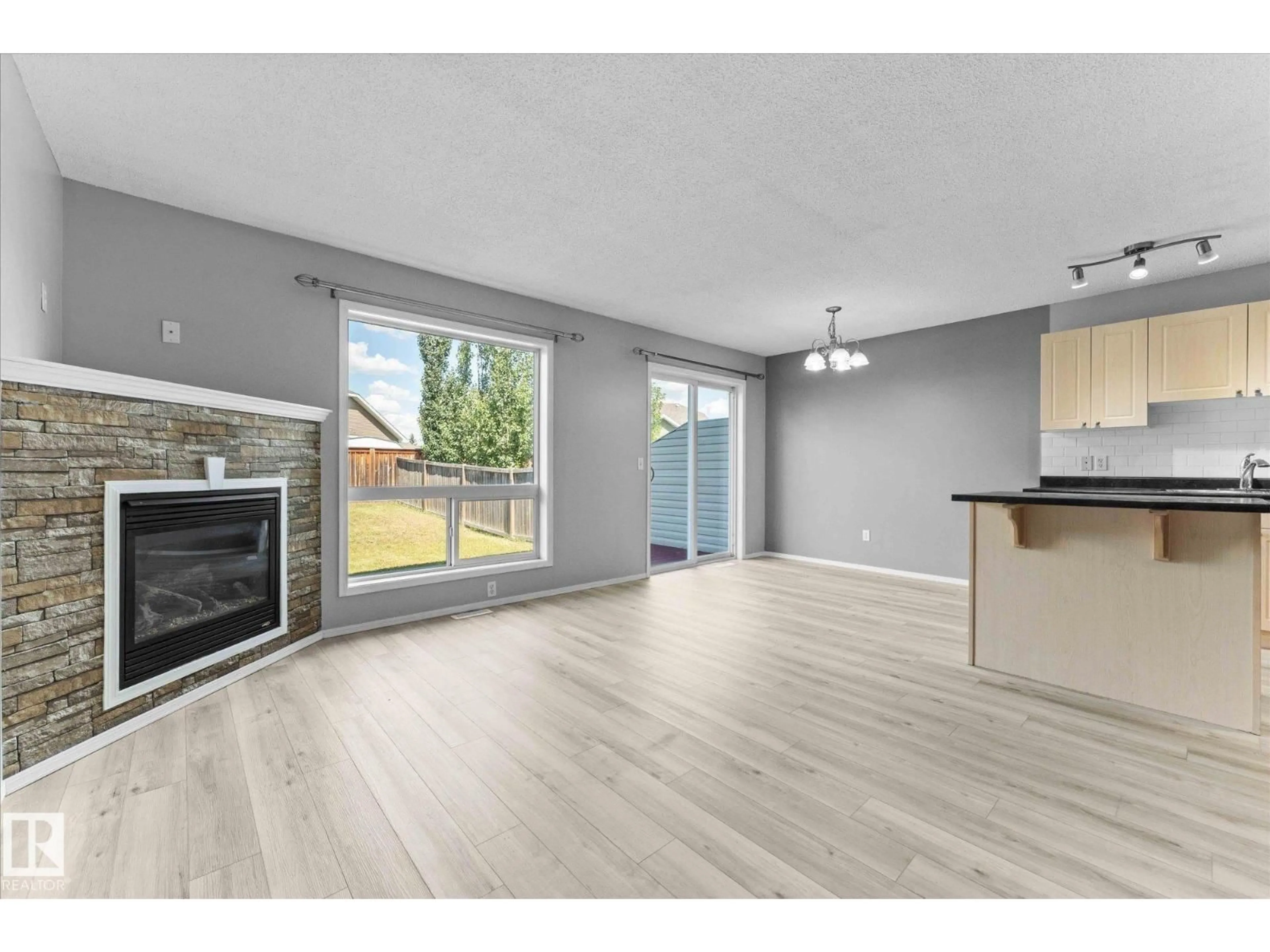 Open concept kitchen, wood/laminate floor for 32 NEVIS CL, St. Albert Alberta T8N0R7