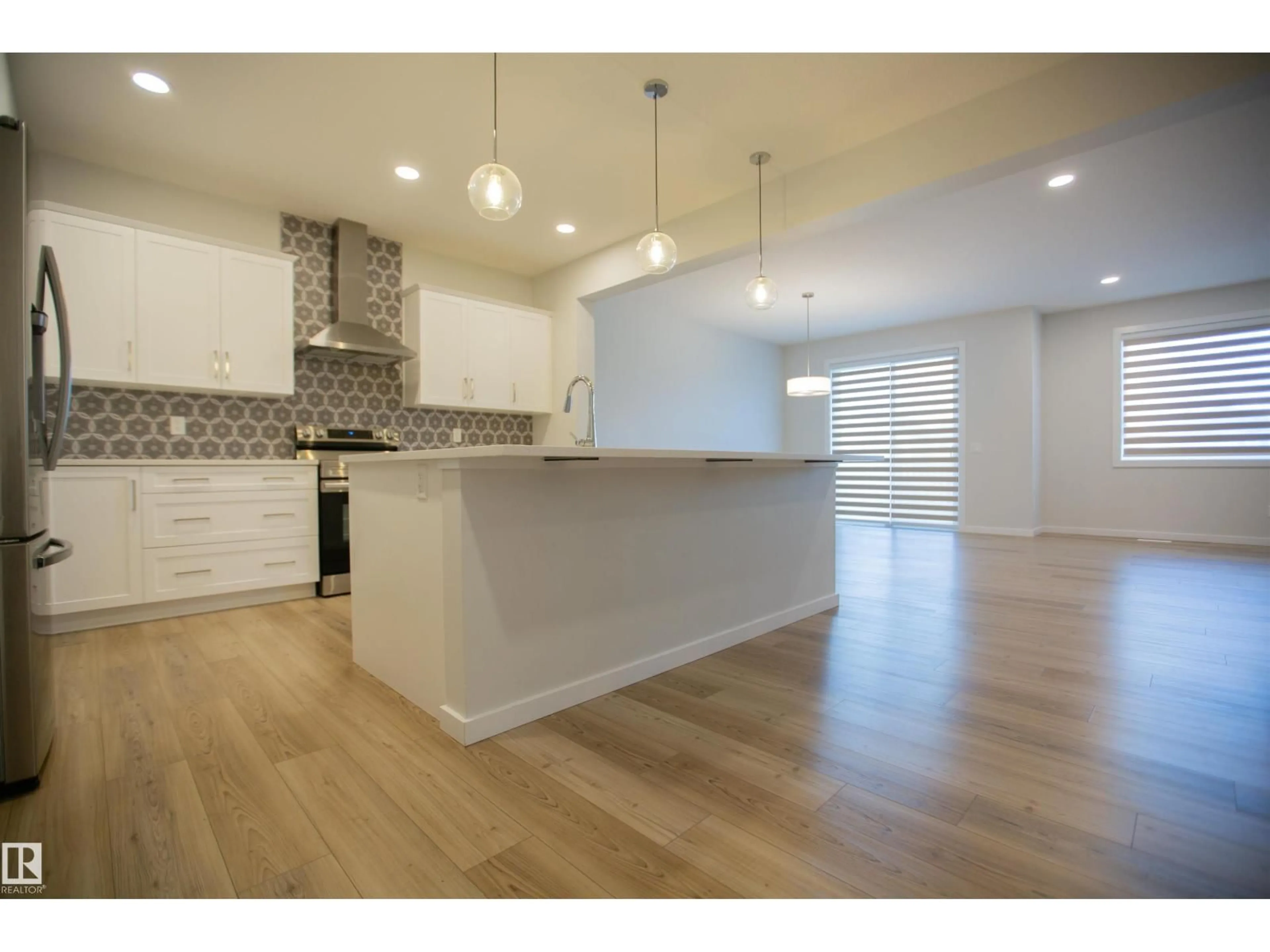 Open concept kitchen, wood/laminate floor for NW - 2815 200 ST, Edmonton Alberta T6M0W8