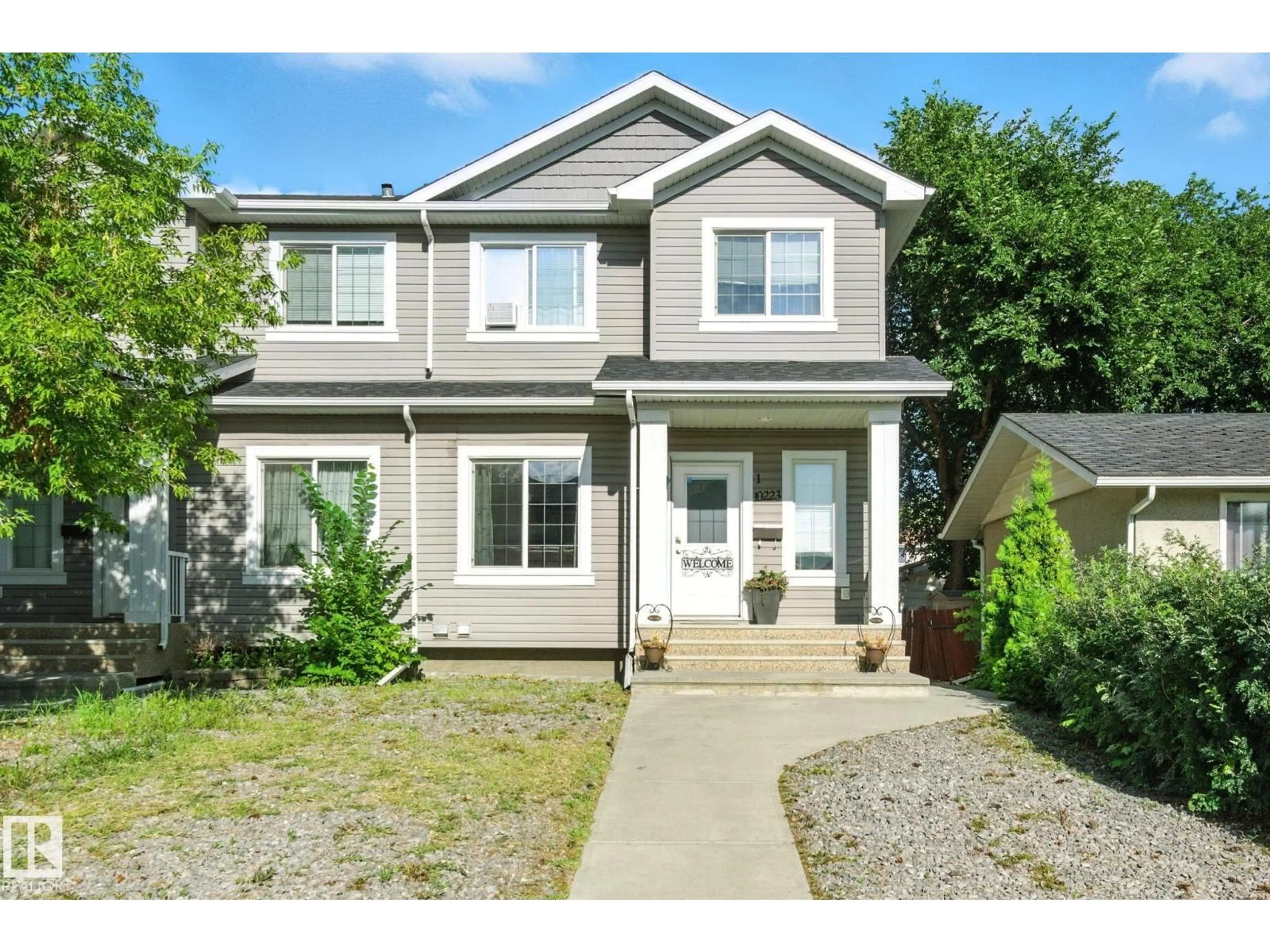 Home with vinyl exterior material, street for NW - 10223 155 ST, Edmonton Alberta T5P2L8