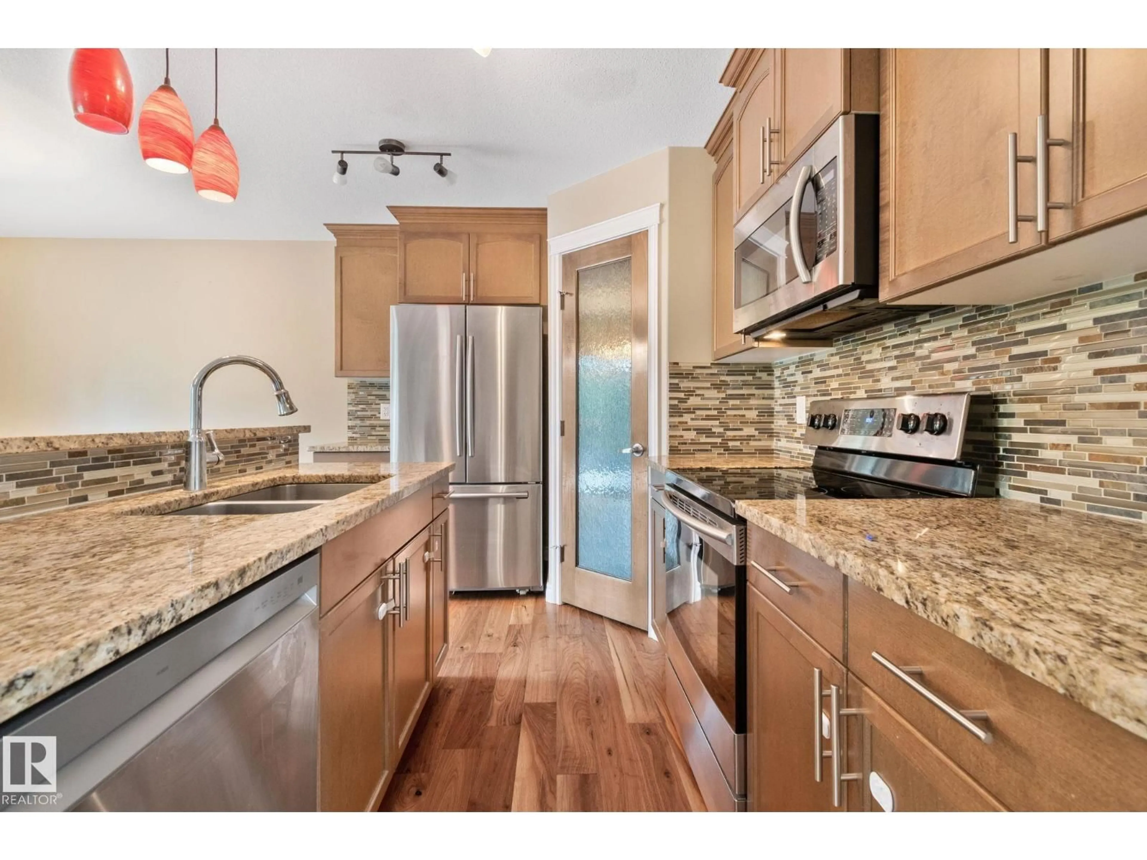 Open concept kitchen, unknown for 21248 96 AV, Edmonton Alberta T5T5X8