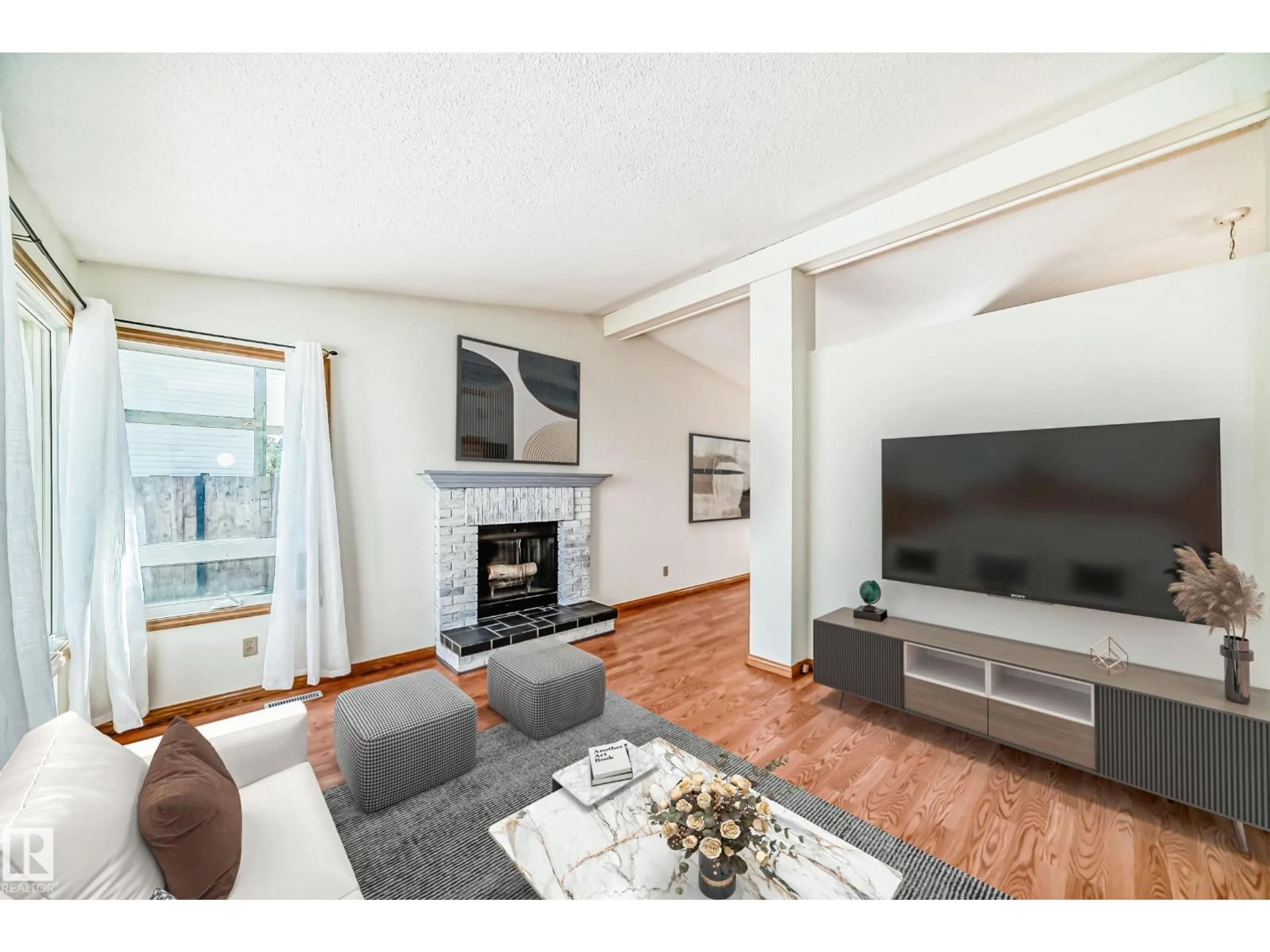 Living room with furniture, wood/laminate floor for 9 WELLINGTON CR, Spruce Grove Alberta T7X1K6