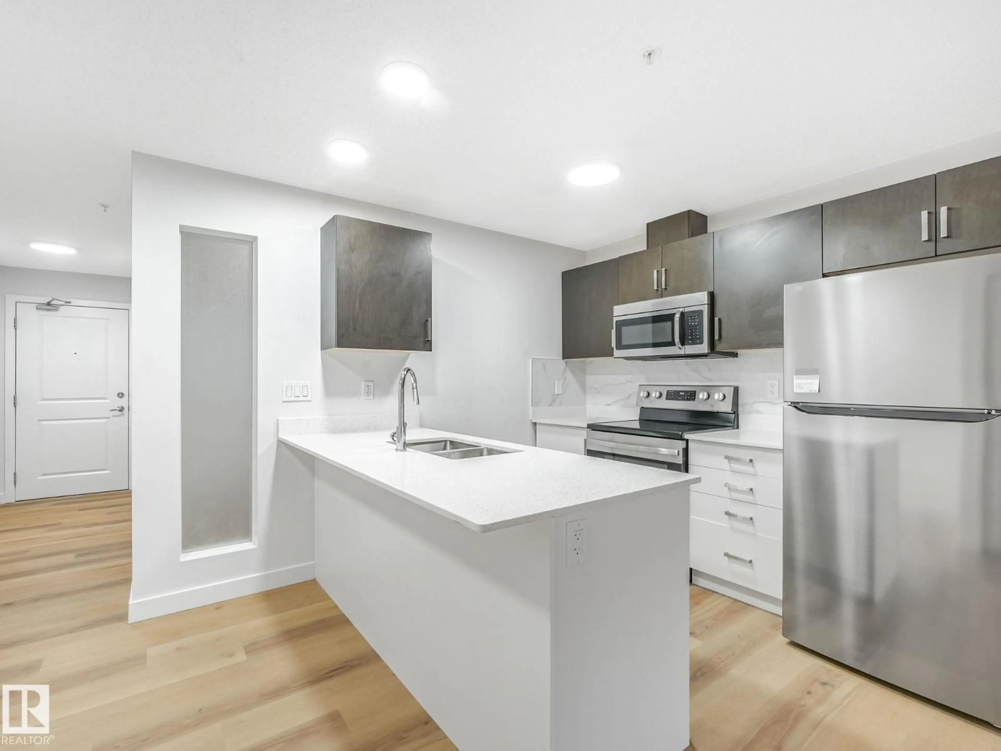 Open concept kitchen, unknown for #121 - 5515 7 AV, Edmonton Alberta T6X2A8