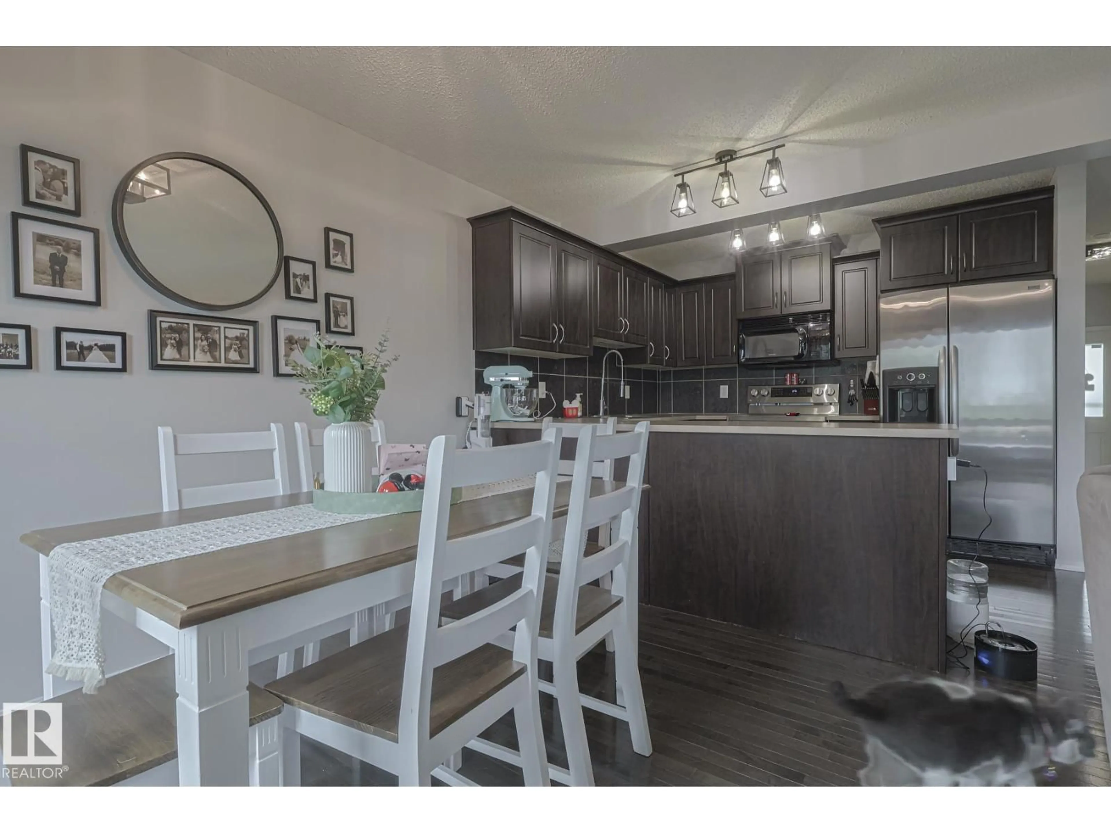 Open concept kitchen, wood/laminate floor for 2 VANESSA AV, Spruce Grove Alberta T7X0B9