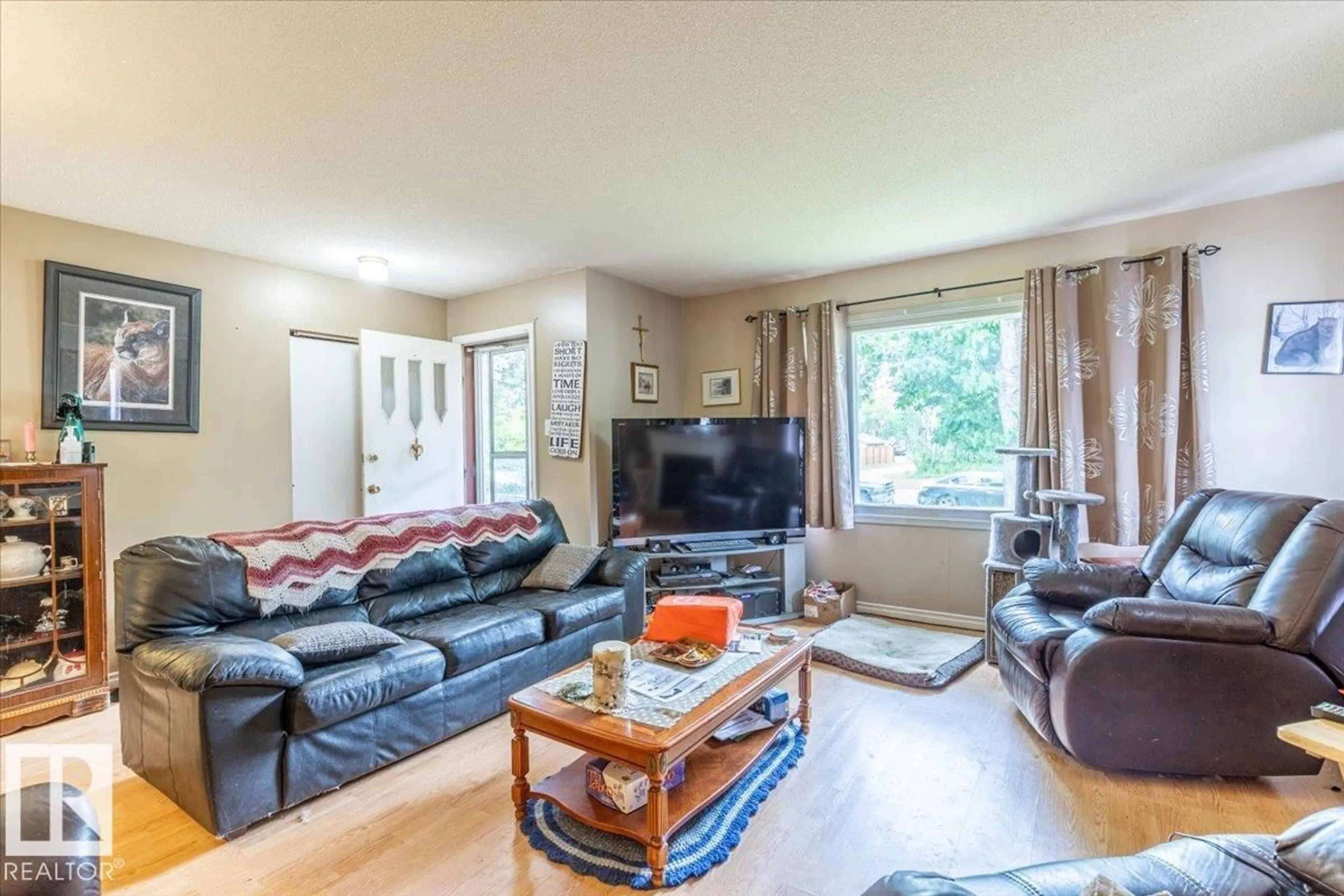 Living room with furniture, wood/laminate floor for 5116 52 ST, Warburg Alberta T0C2T0