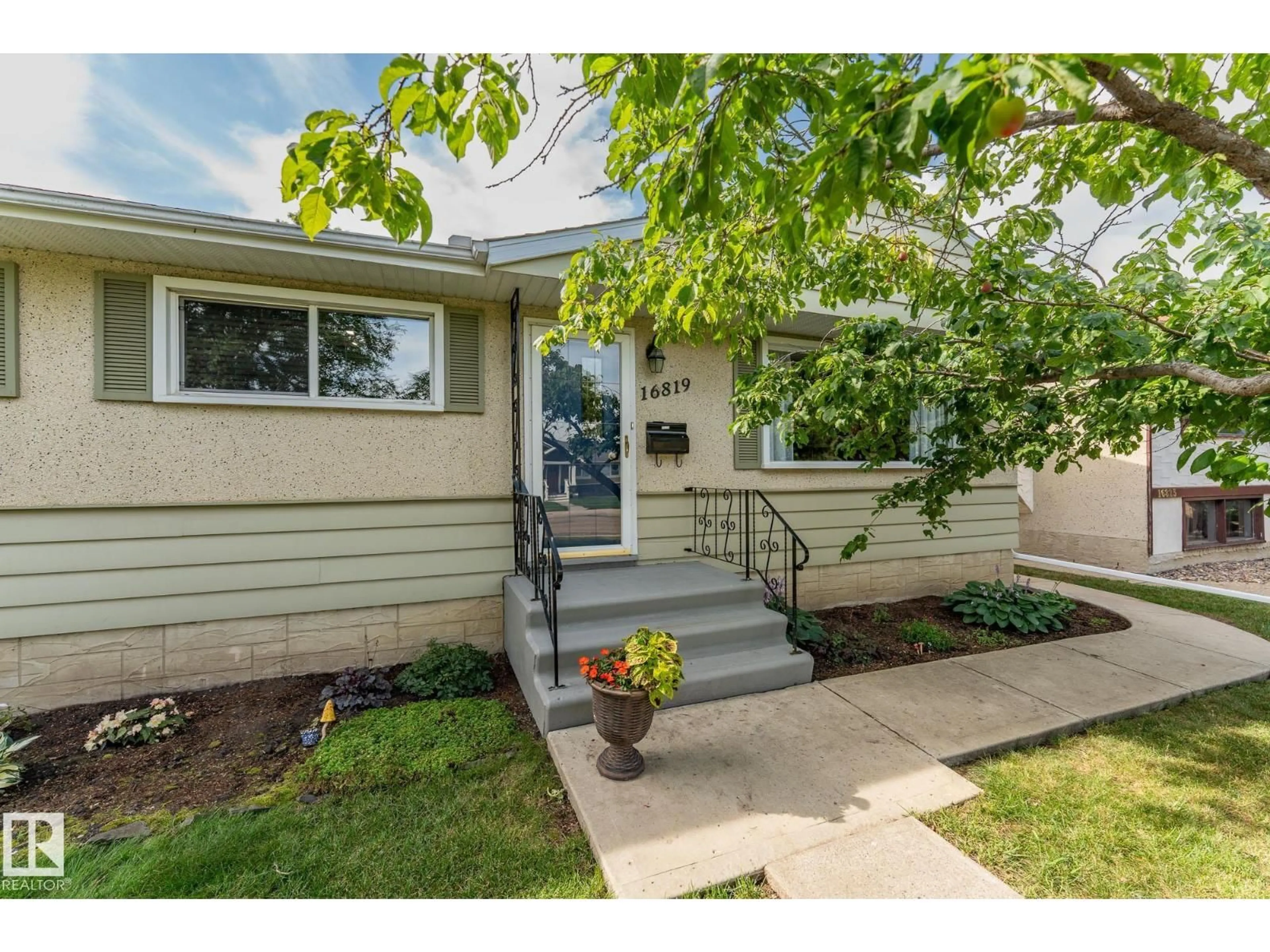 Home with vinyl exterior material, street for 16819 98 AV, Edmonton Alberta T5P0G9