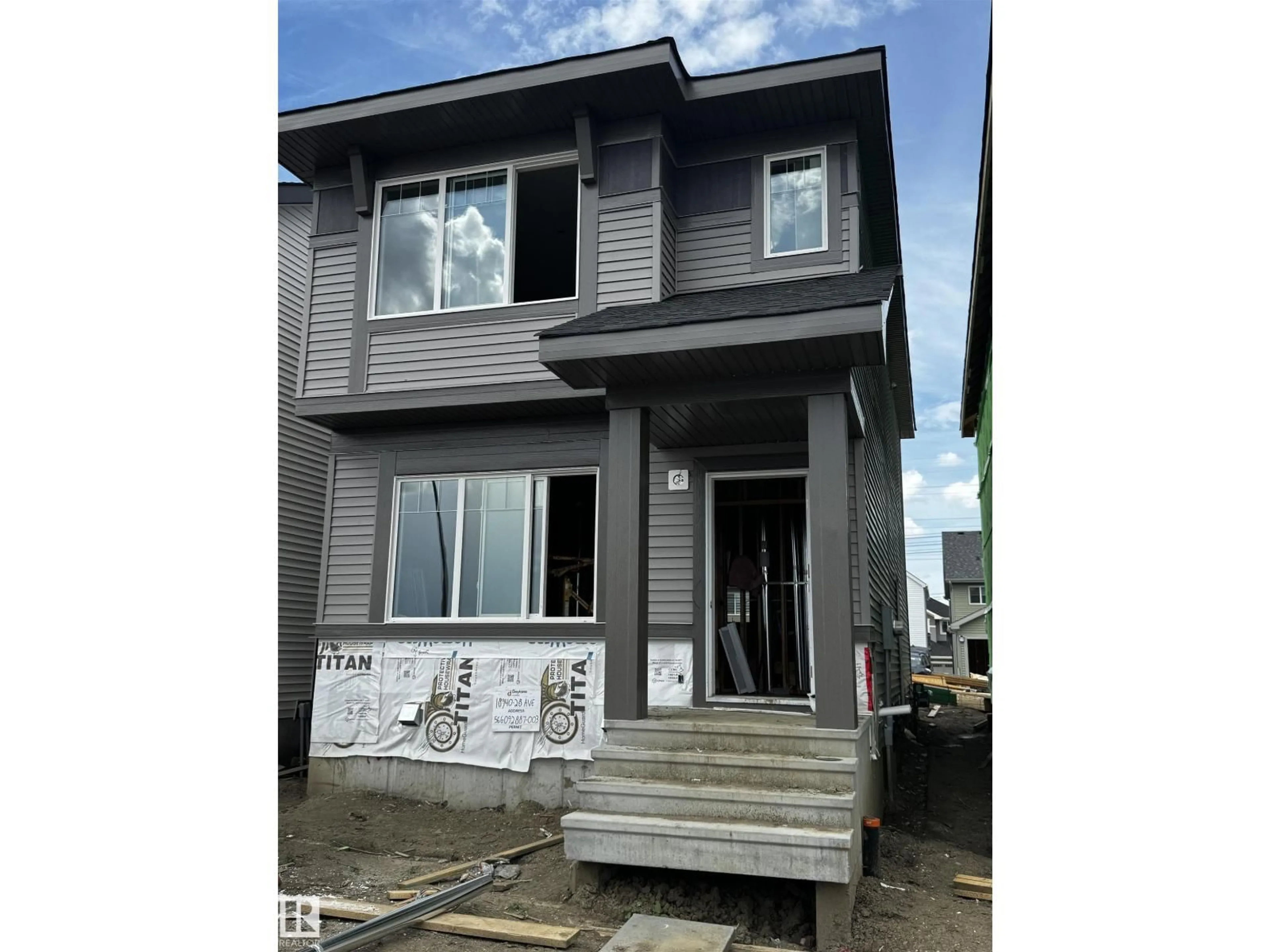 Home with vinyl exterior material, street for NW - 18940 28 AV, Edmonton Alberta T6M3H2