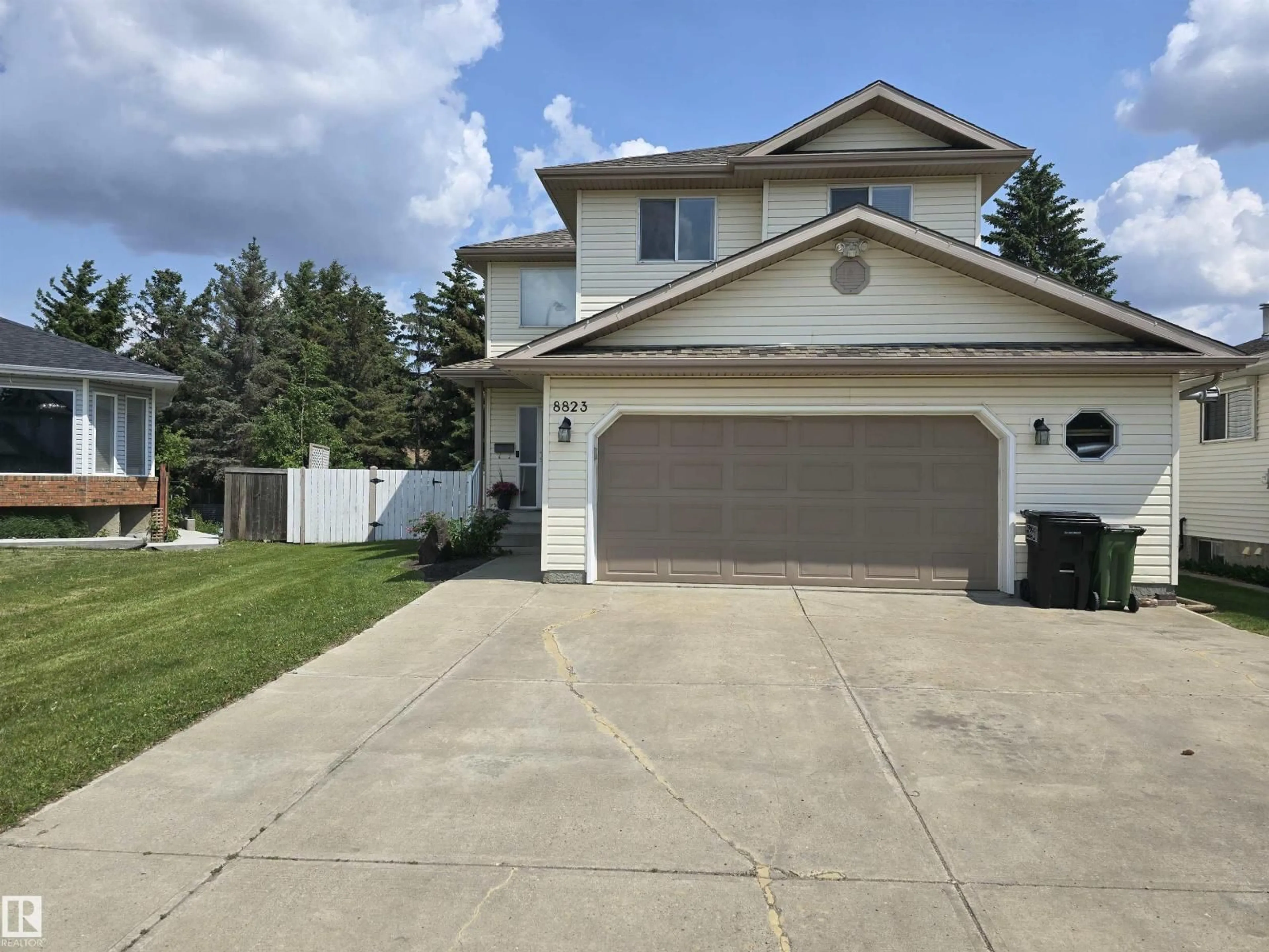 Home with vinyl exterior material, street for NW - 8823 188 ST, Edmonton Alberta T5T5Z8