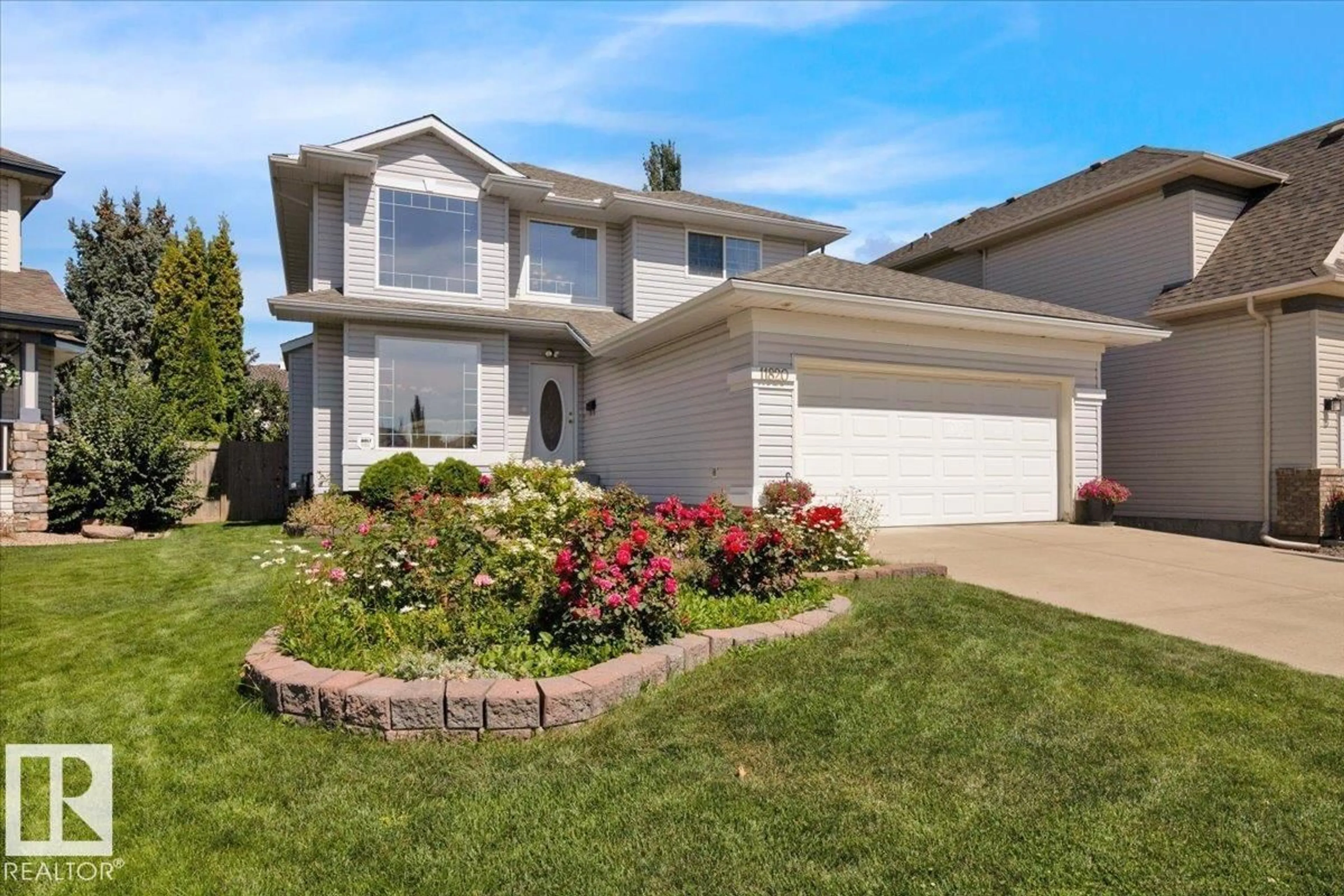 Home with vinyl exterior material, street for 11820 13 AV, Edmonton Alberta T6J7E9