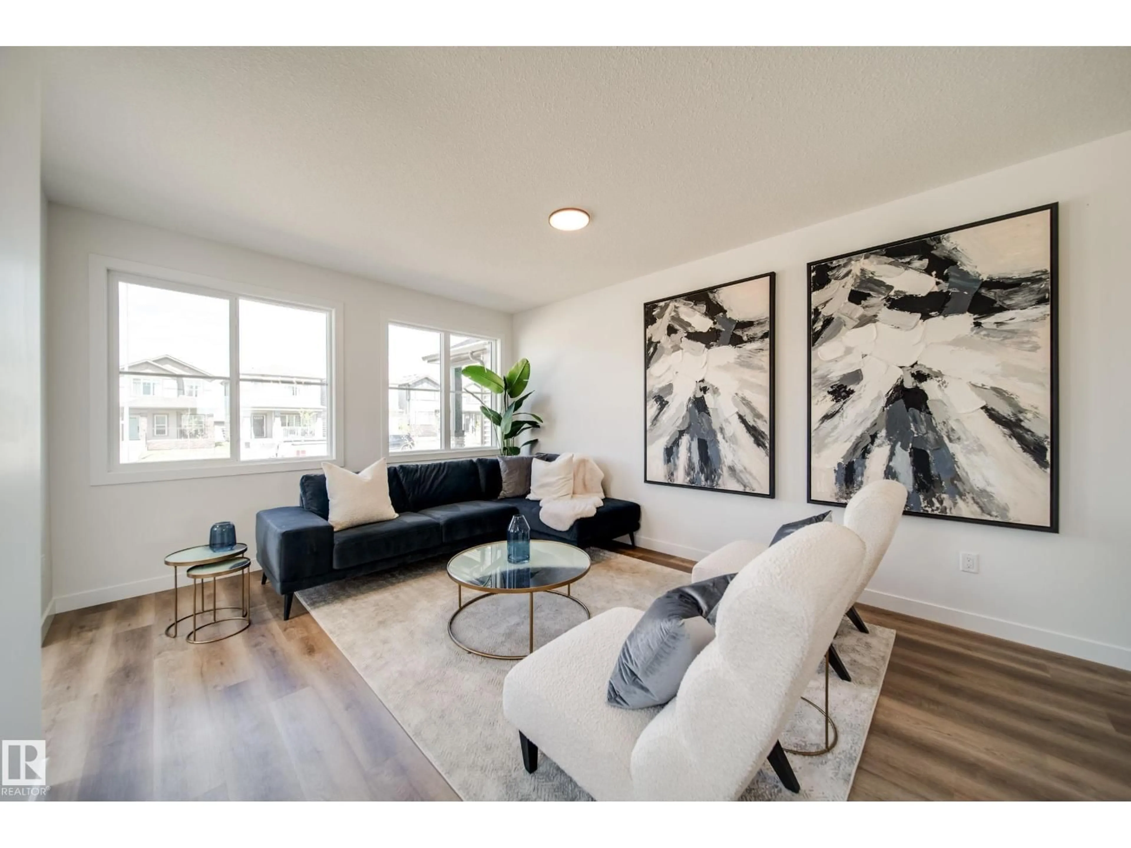 Living room with furniture, wood/laminate floor for 59 SIENNA BV, Fort Saskatchewan Alberta T8L0W3