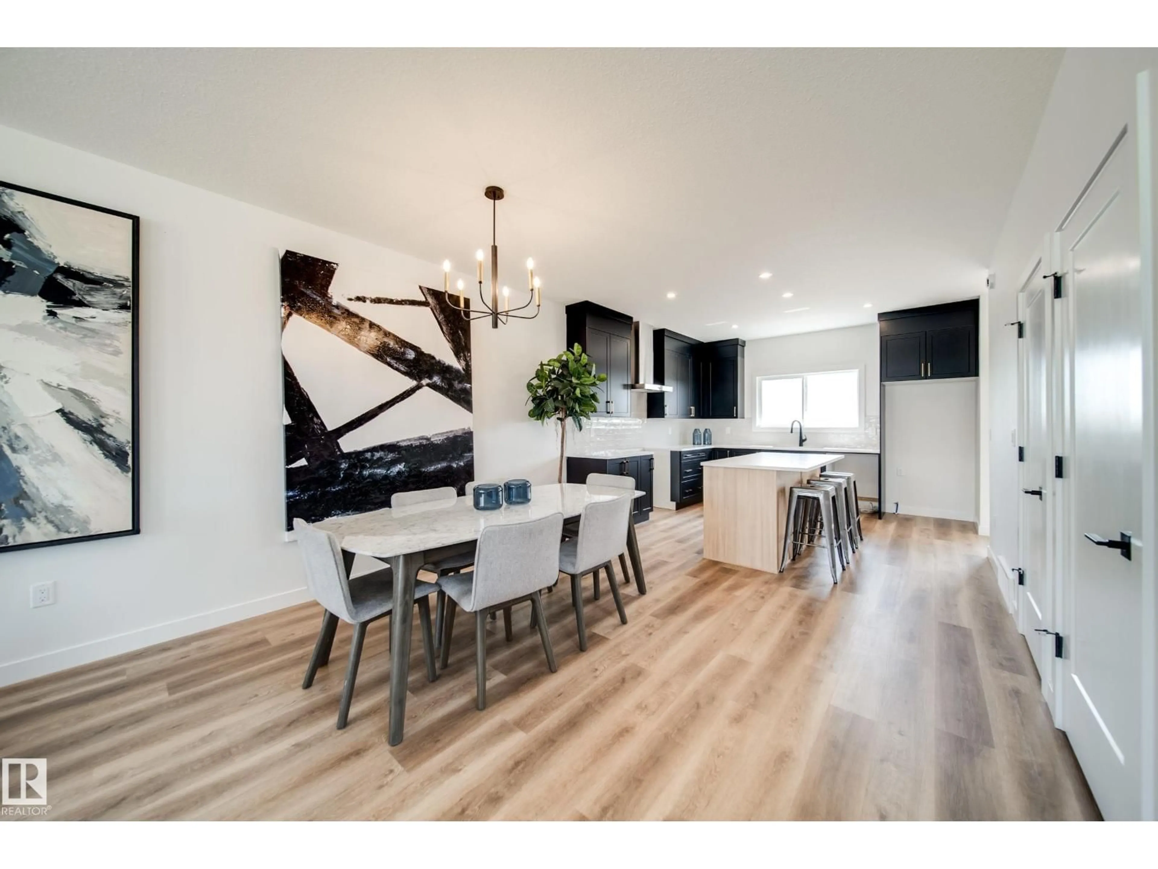 Open concept kitchen, wood/laminate floor for 59 SIENNA BV, Fort Saskatchewan Alberta T8L0W3