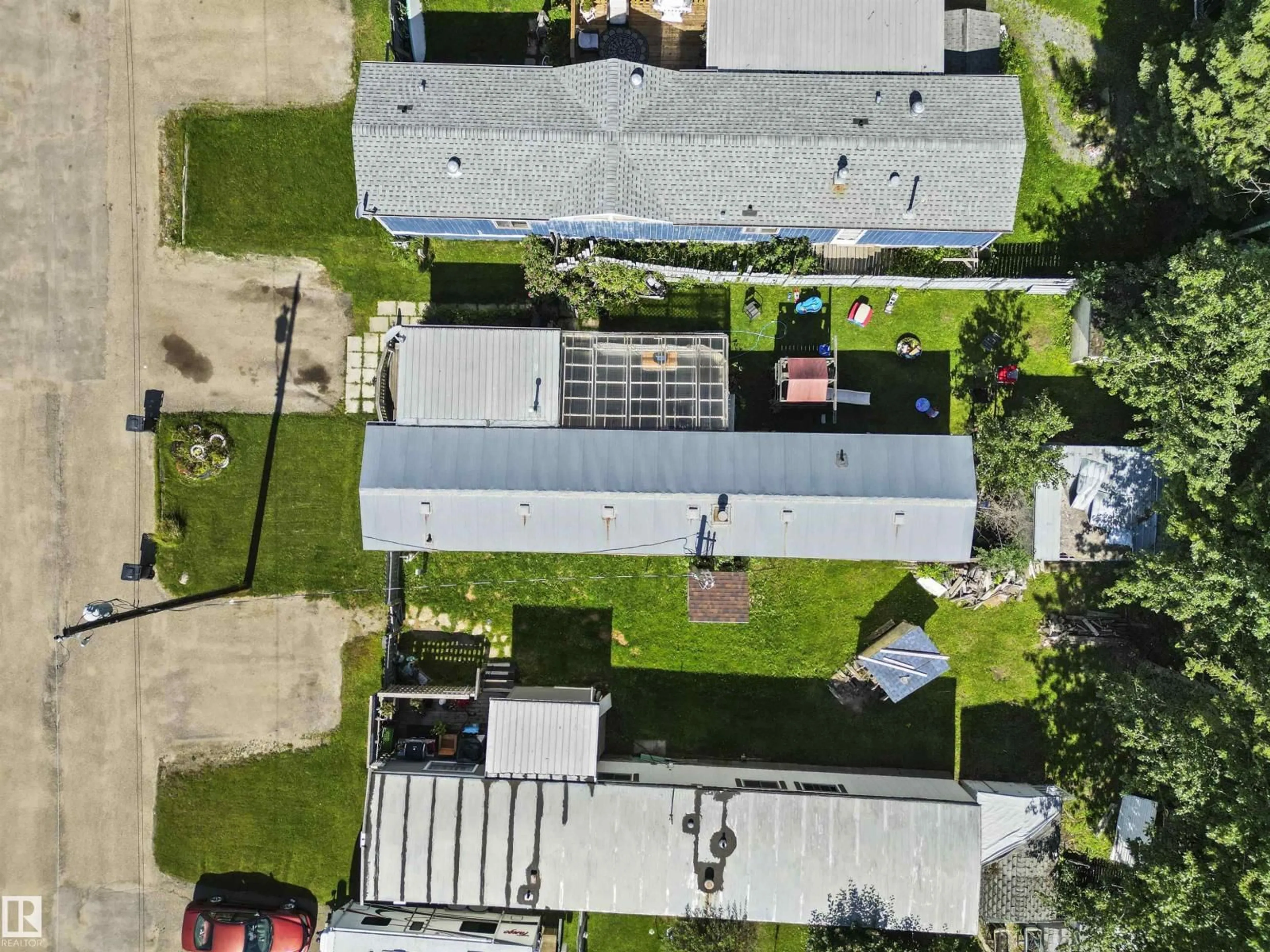 A pic from outside/outdoor area/front of a property/back of a property/a pic from drone, street for #80 - 5644 50 STREET, Drayton Valley Alberta T7A1L4