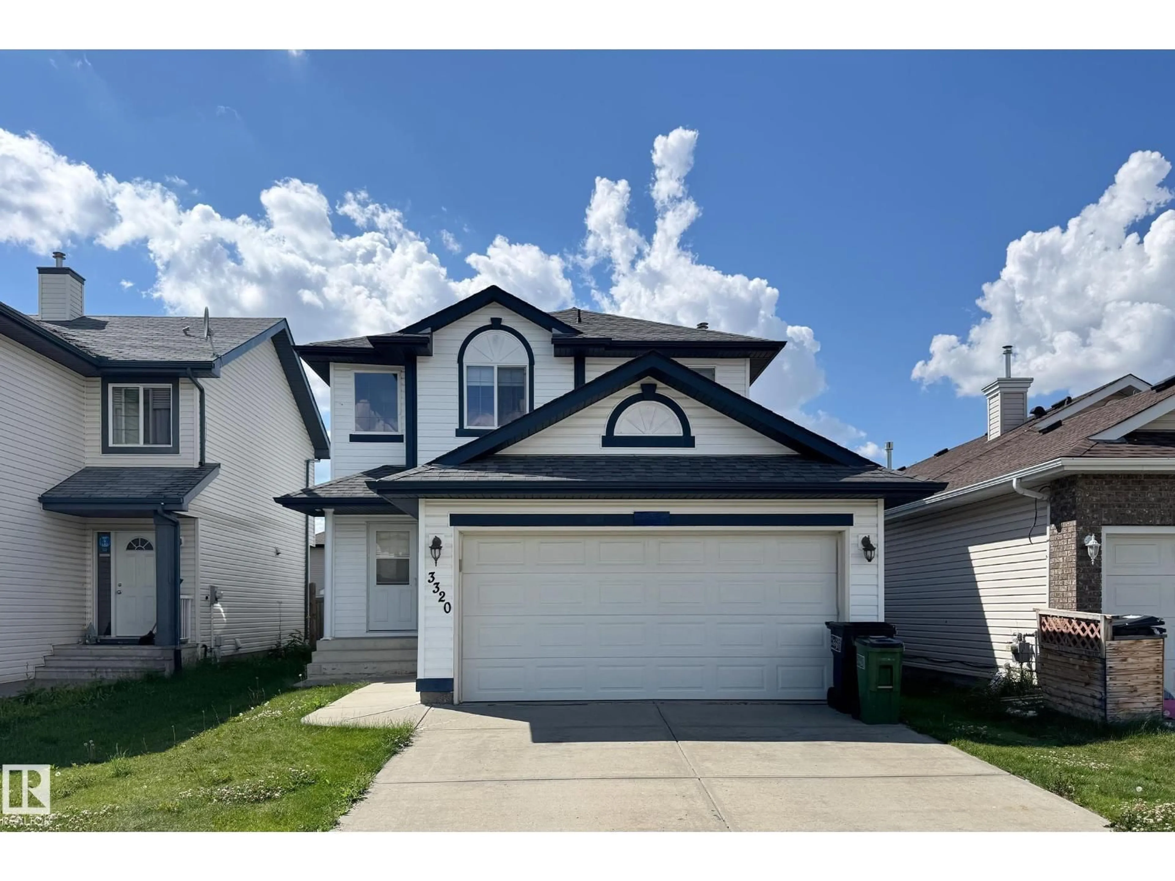 Home with vinyl exterior material, street for 3320 20 ST, Edmonton Alberta T6T0L5