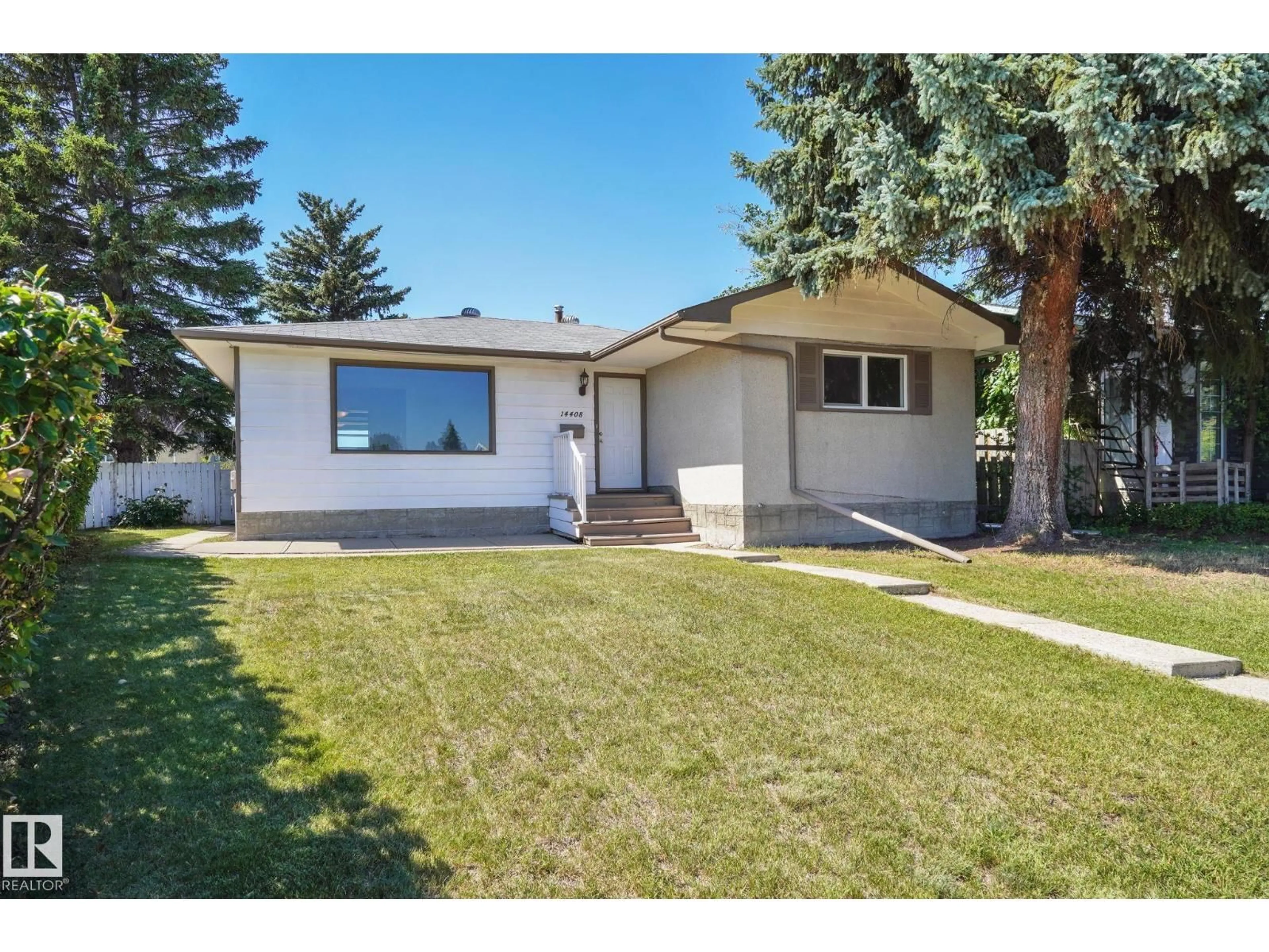 Home with vinyl exterior material, street for NW - 14408 65 ST, Edmonton Alberta T5A2C7