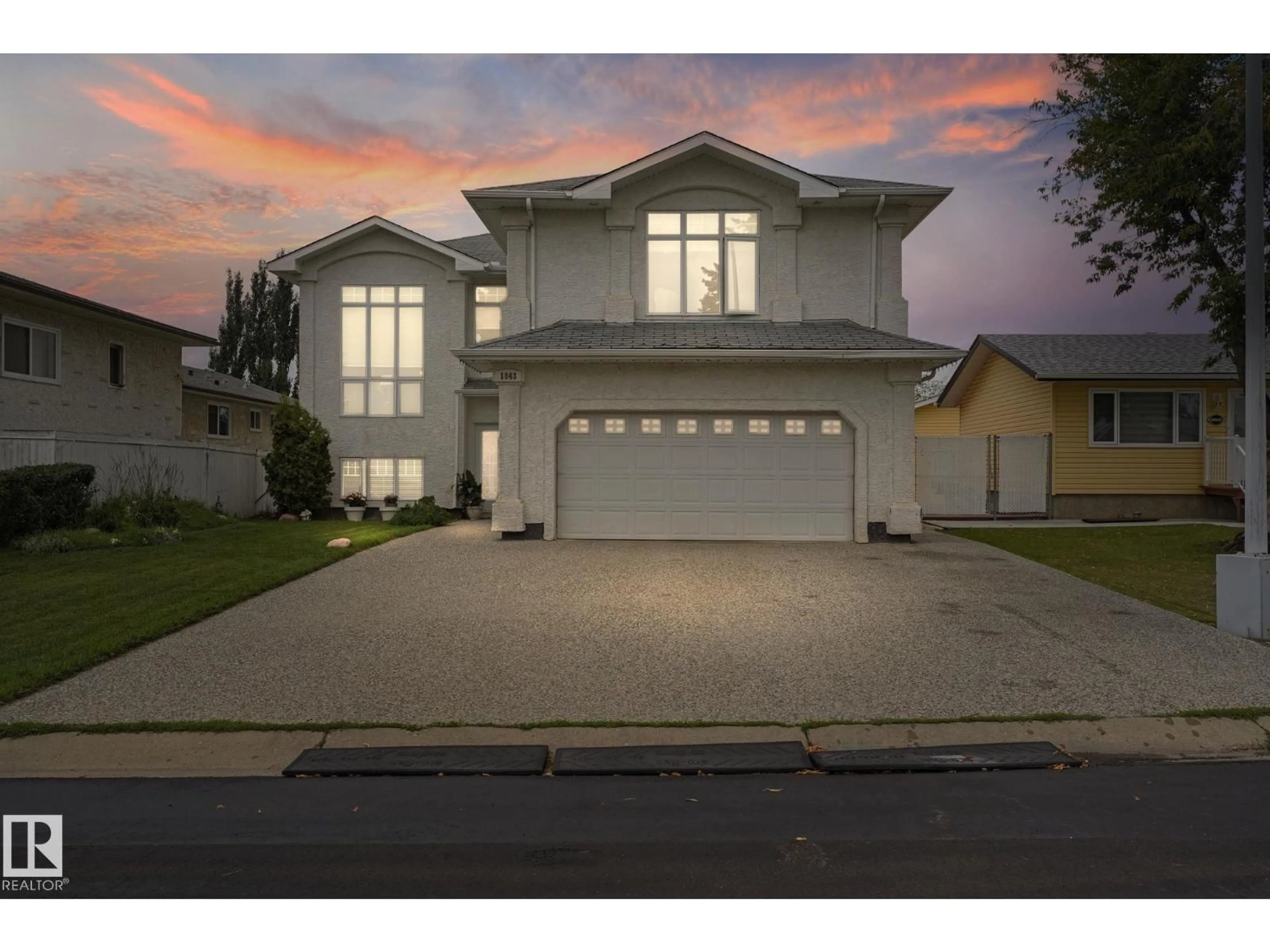Home with vinyl exterior material, street for NW - 1843 45 ST, Edmonton Alberta T6L2S6