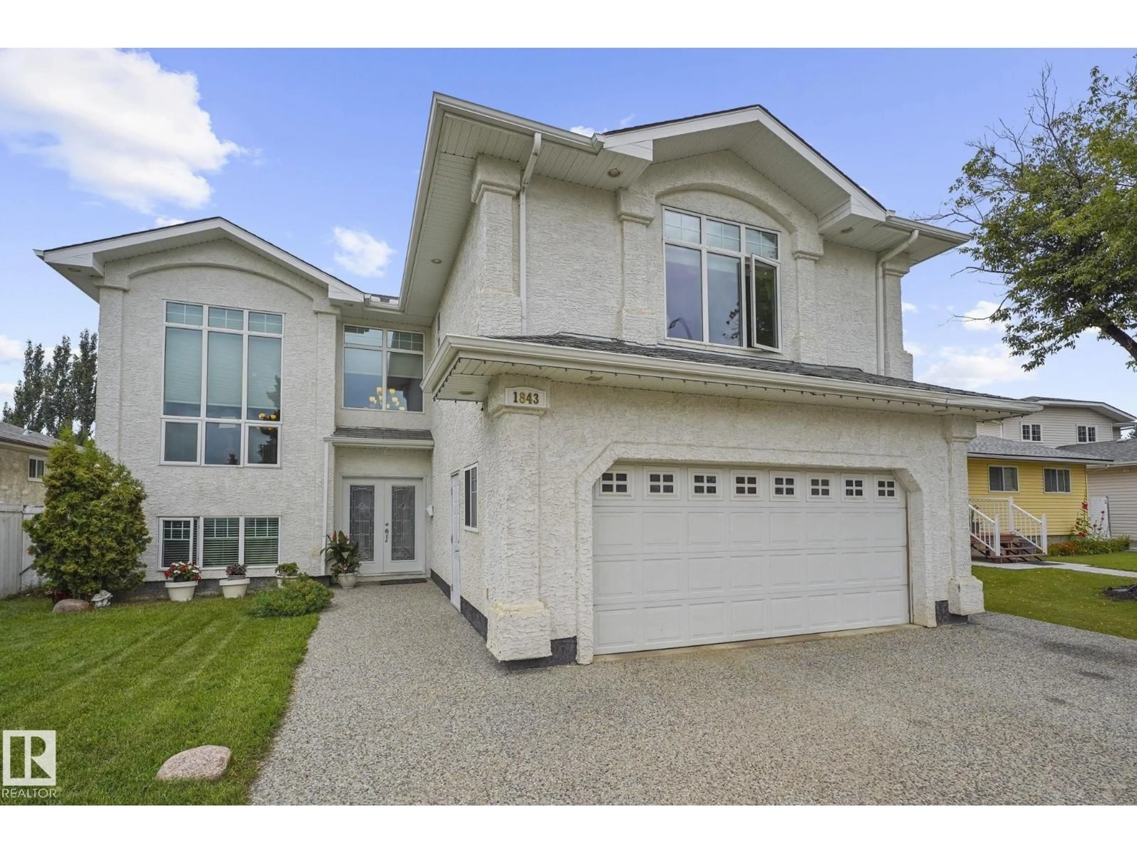Home with vinyl exterior material, street for NW - 1843 45 ST, Edmonton Alberta T6L2S6