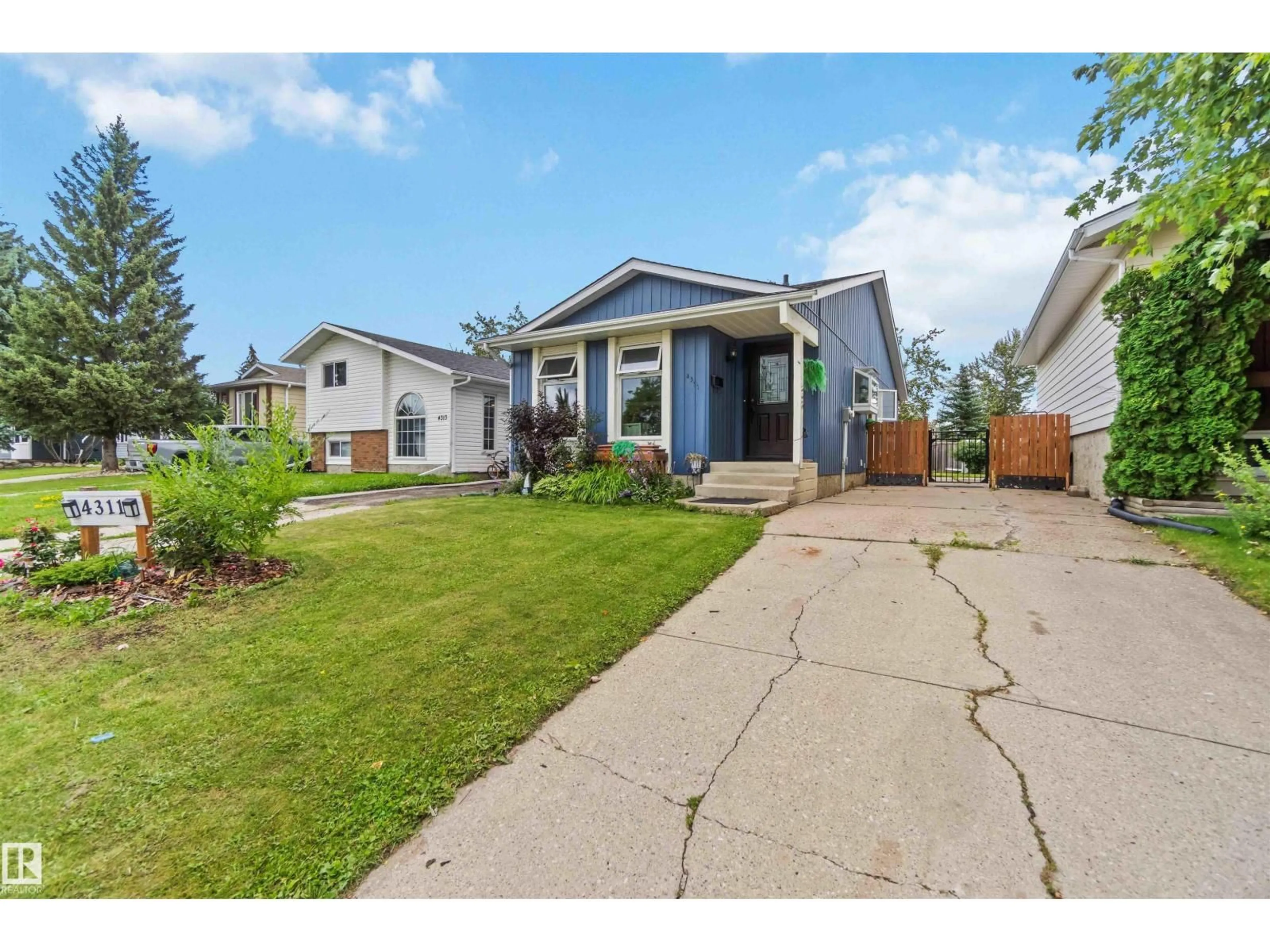 Home with vinyl exterior material, street for 4311 54 ST, Beaumont Alberta T4X1C6