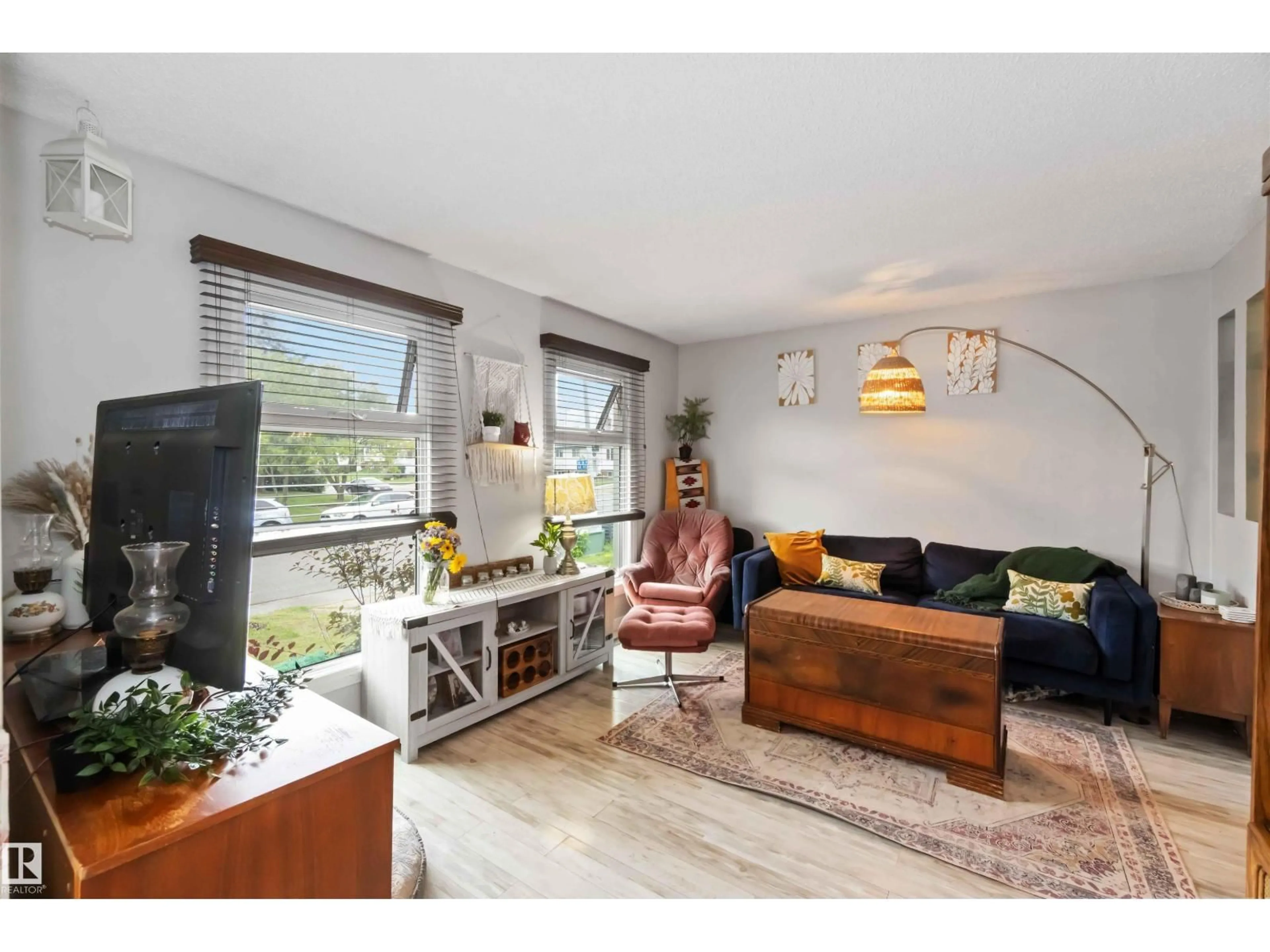 Living room with furniture, wood/laminate floor for 4311 54 ST, Beaumont Alberta T4X1C6
