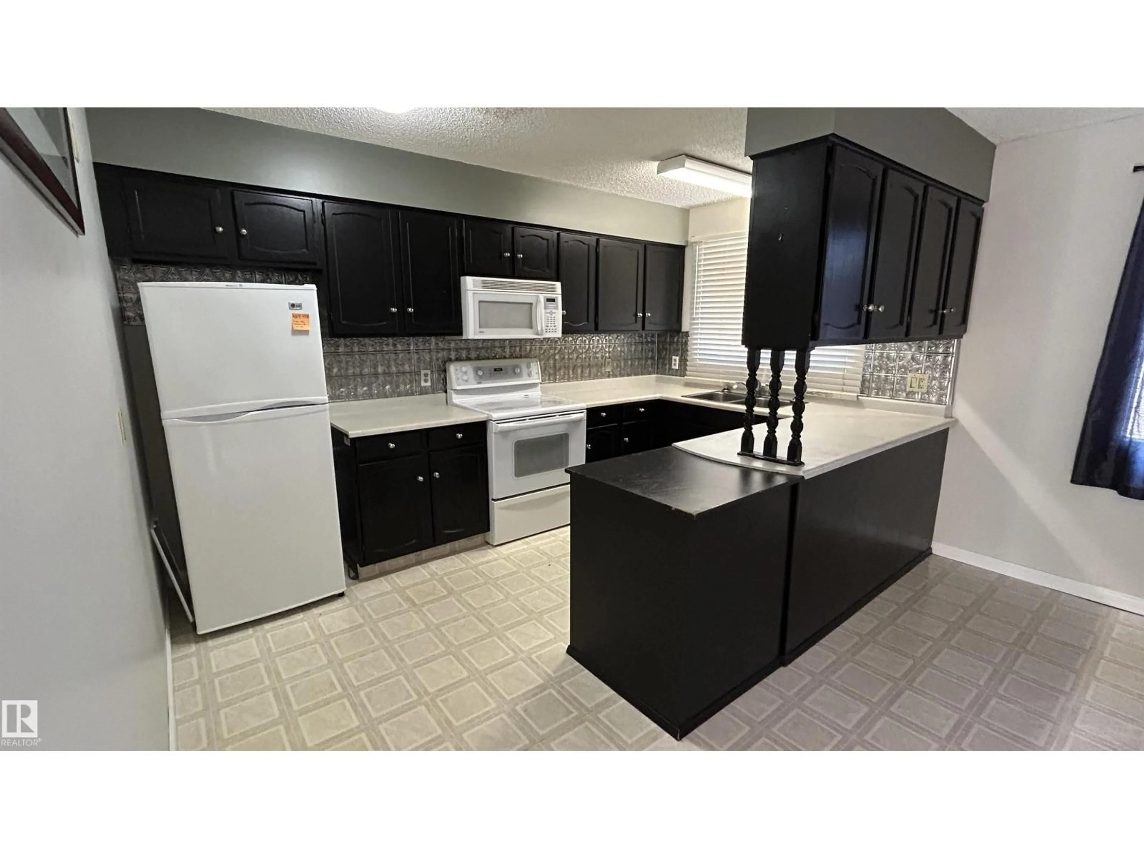 Standard kitchen, ceramic/tile floor for 4819 49 ST, Glendon Alberta T0A1P0