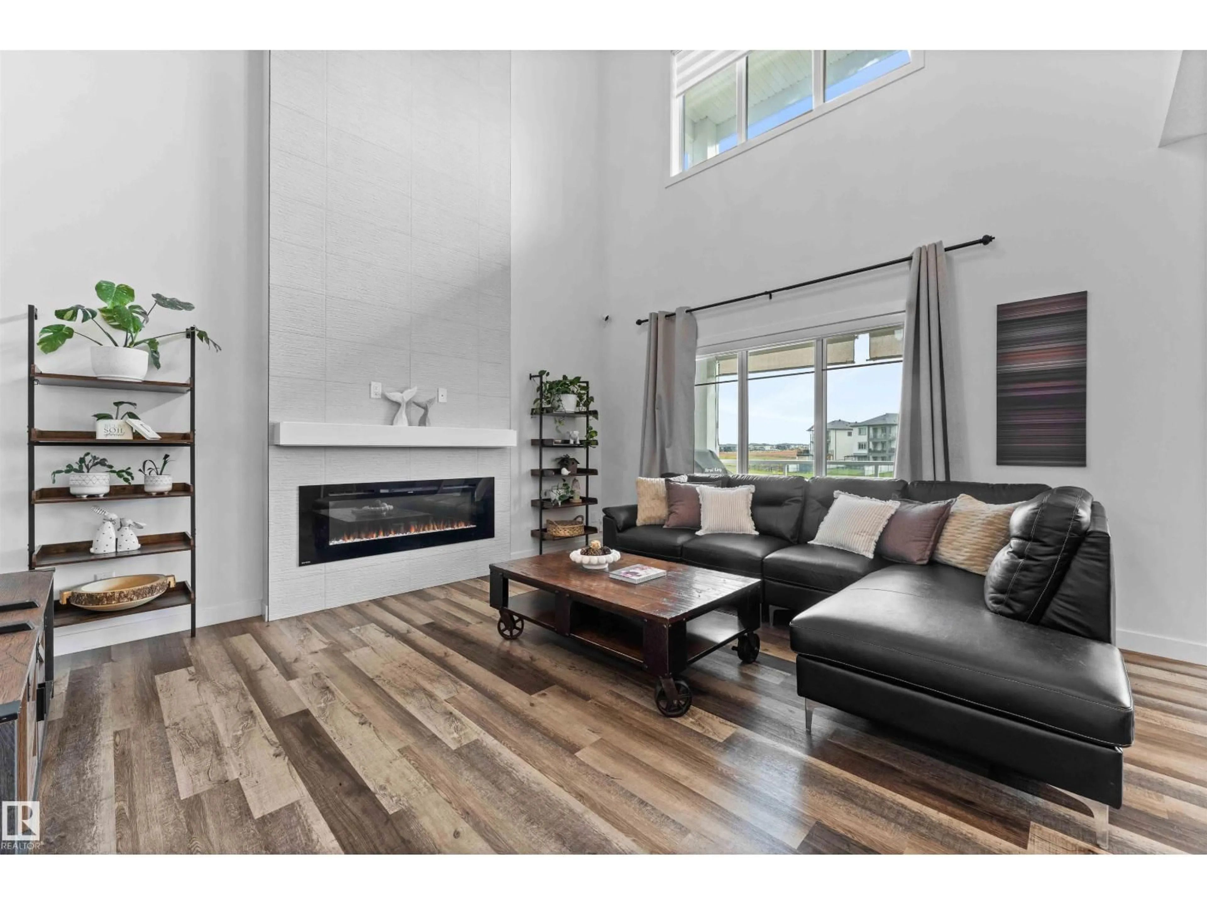 Living room with furniture, wood/laminate floor for 57 DALQUIST BA, Leduc Alberta T9E0N5