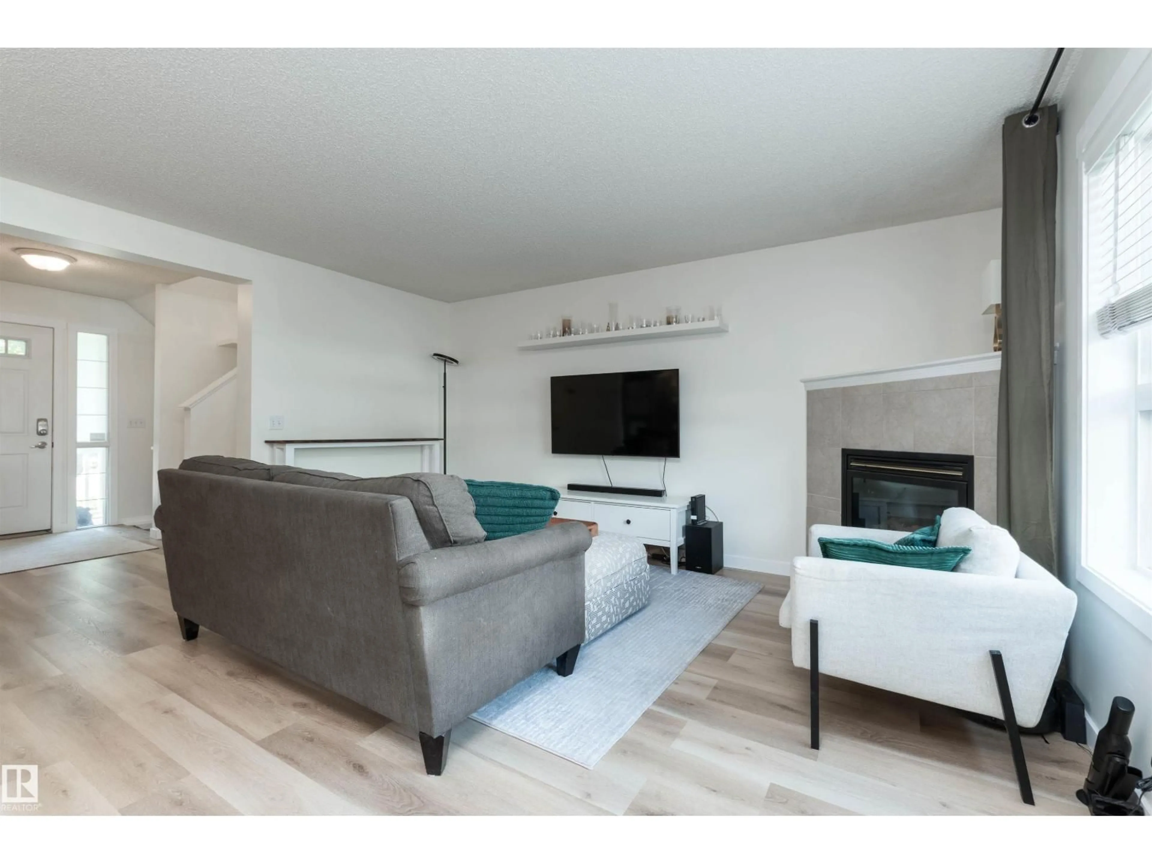 Living room with furniture, wood/laminate floor for 5 CARLYLE CR, Sherwood Park Alberta T8H2T6
