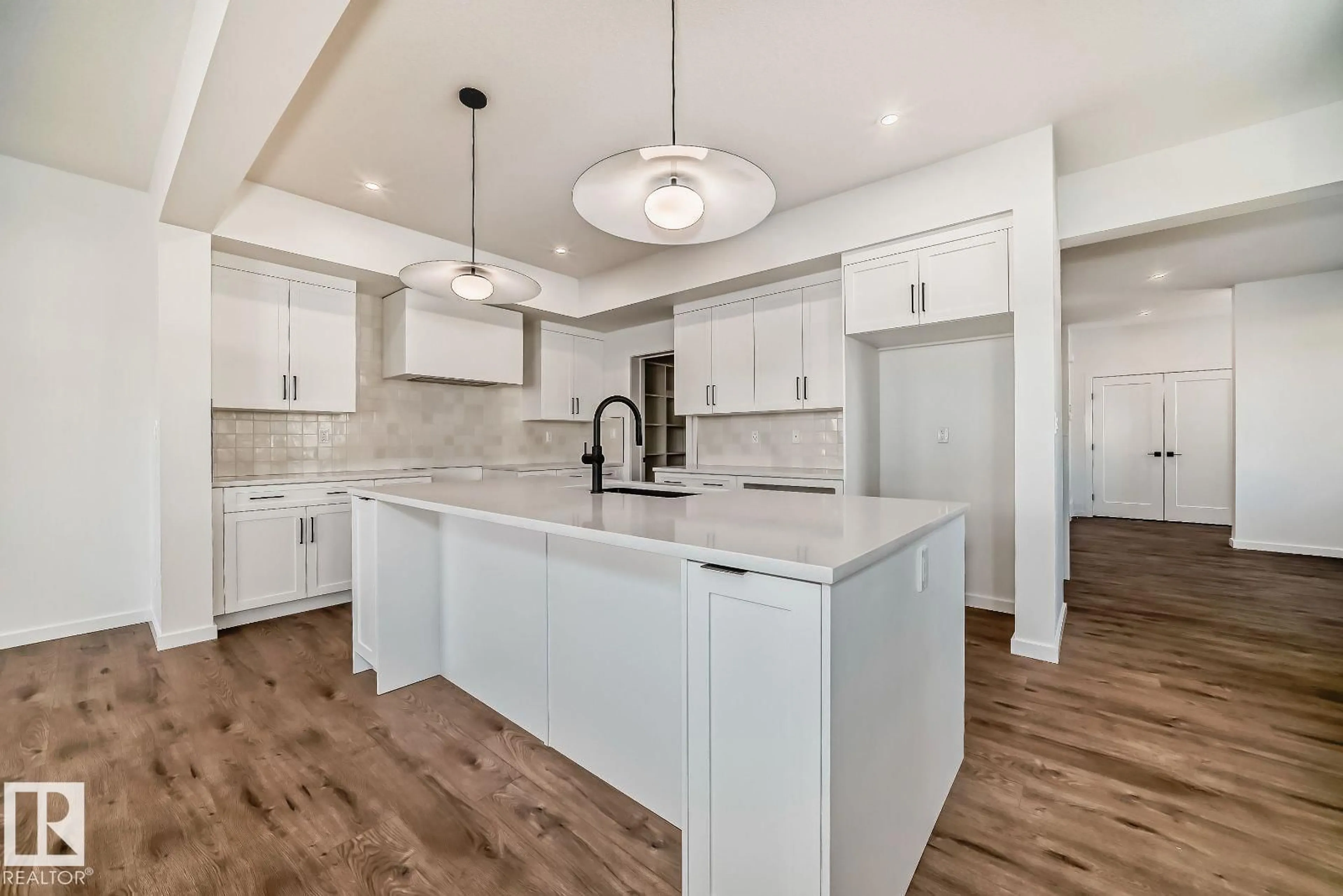 Open concept kitchen, ceramic/tile floor for 1365 AINSLIE WD, Edmonton Alberta T6W3E9