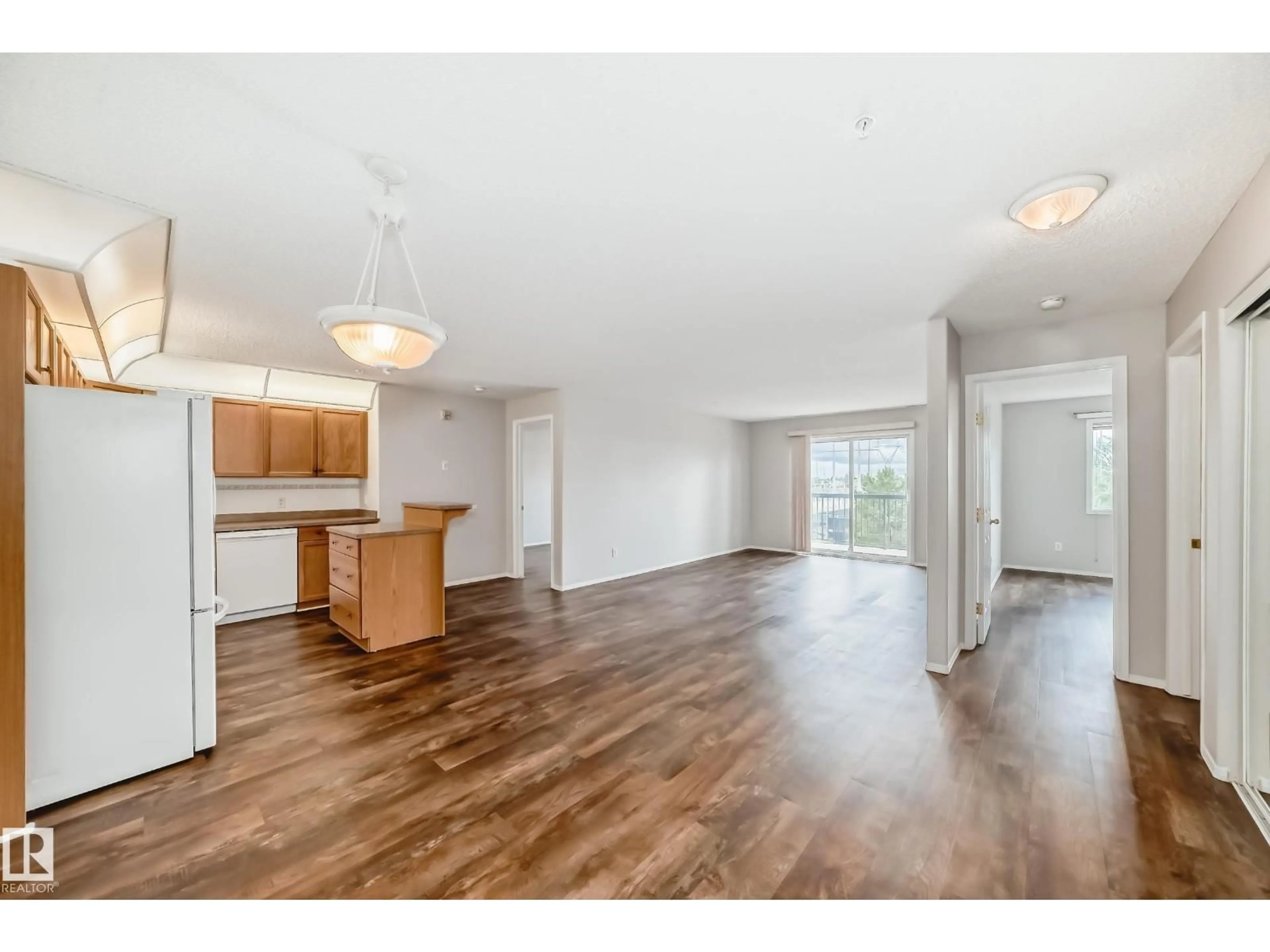 Open concept kitchen, wood/laminate floor for #323 - 16303 95 ST, Edmonton Alberta T5Z3V1