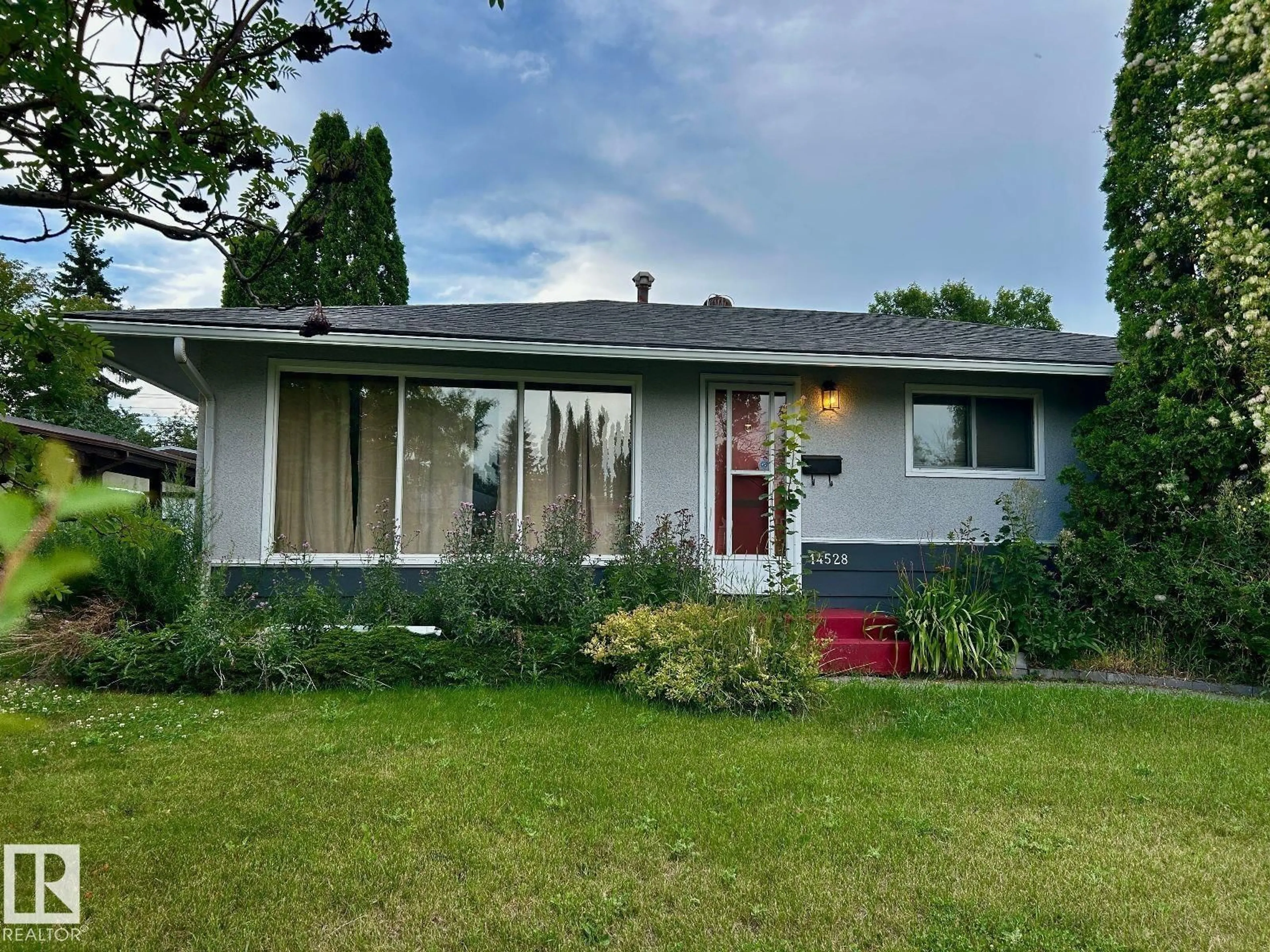 Home with vinyl exterior material, street for 14528 87 AV, Edmonton Alberta T5R4E4