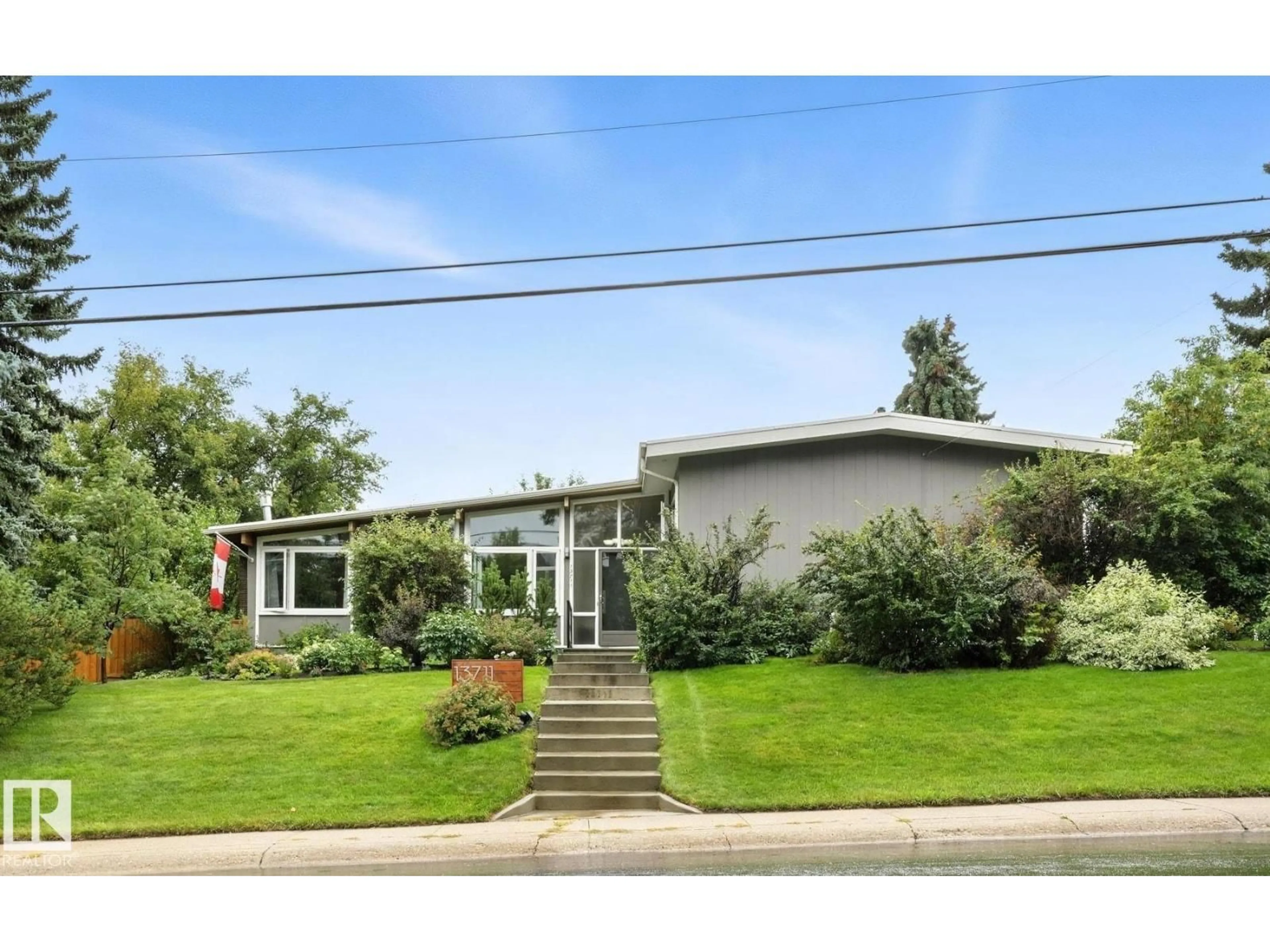 Home with vinyl exterior material, street for 13711 81 AV, Edmonton Alberta T5R3N9