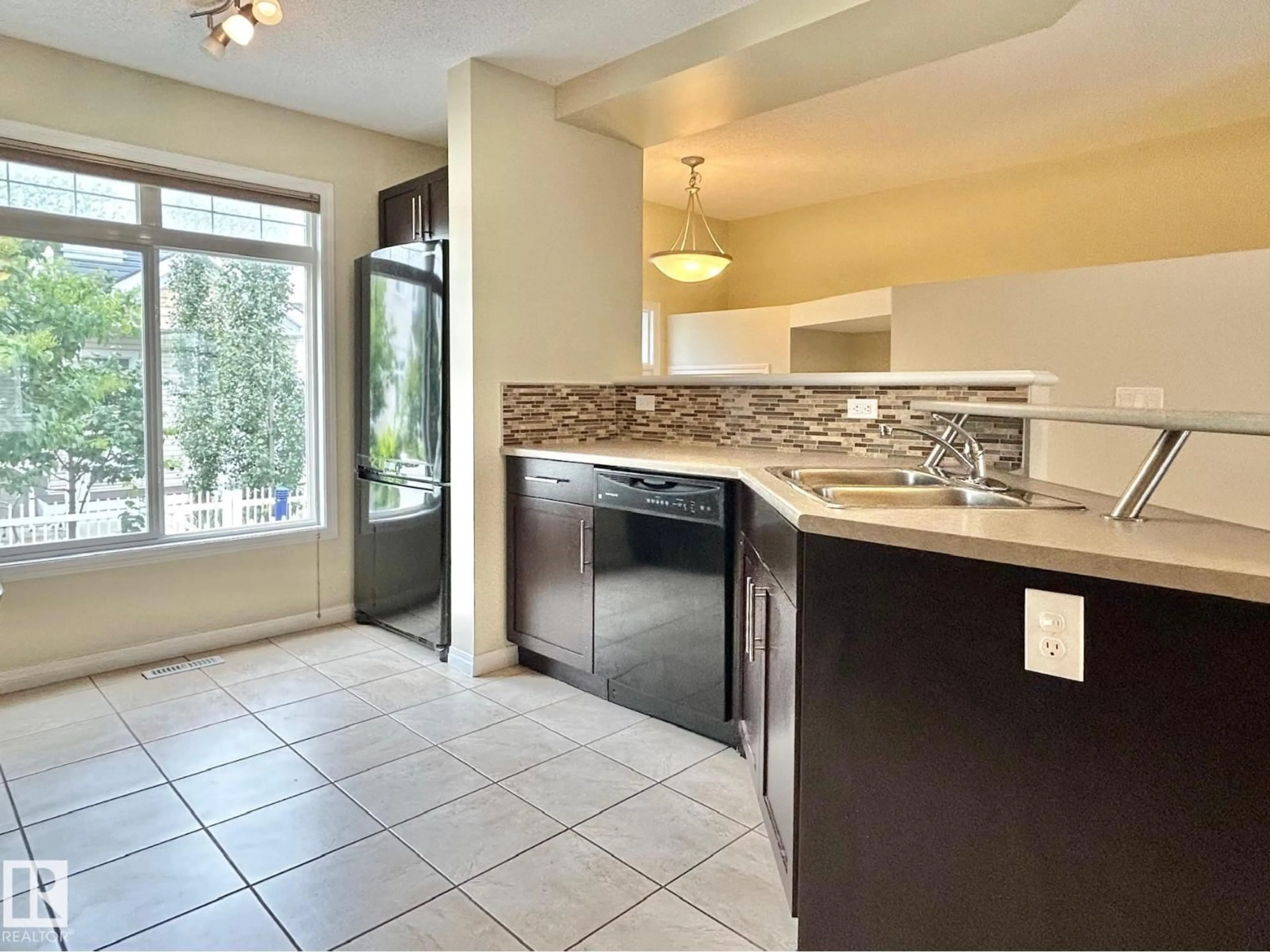 Open concept kitchen, ceramic/tile floor for #143 - 1804 70 ST, Edmonton Alberta T6X0H4